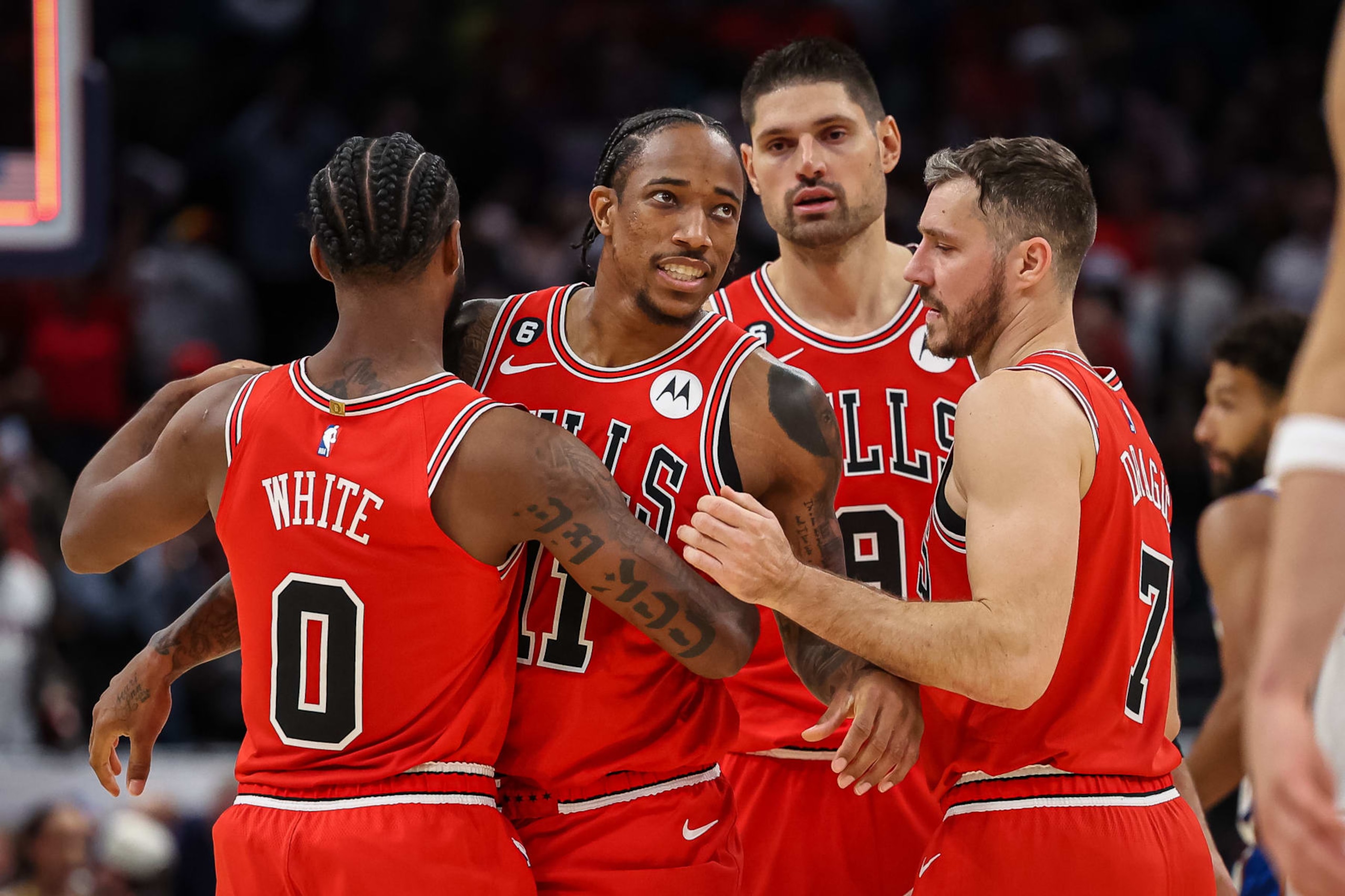 WASHINGTON, DC - OCTOBER 21: DeMar DeRozan #11 of the Chicago Bulls is consoled by teammates after missing the potential game winning three point basket with two seconds left in the game against the Washington Wizards at Capital One Arena on October 21, 2022 in Washington, DC. NOTE TO USER: User expressly acknowledges and agrees that, by downloading and or using this photograph, User is consenting to the terms and conditions of the Getty Images License Agreement. (Photo by Scott Taetsch/Getty Images) WASHINGTON, DC - OCTOBER 21: DeMar DeRozan #11 of the Chicago Bulls is consoled by teammates after missing the potential game winning three point basket with two seconds left in the game against the Washington Wizards at Capital One Arena on October 21, 2022 in Washington, DC. NOTE TO USER: User expressly acknowledges and agrees that, by downloading and or using this photograph, User is consenting to the terms and conditions of the Getty Images License Agreement. (Photo by Scott Taetsch/Getty Images)