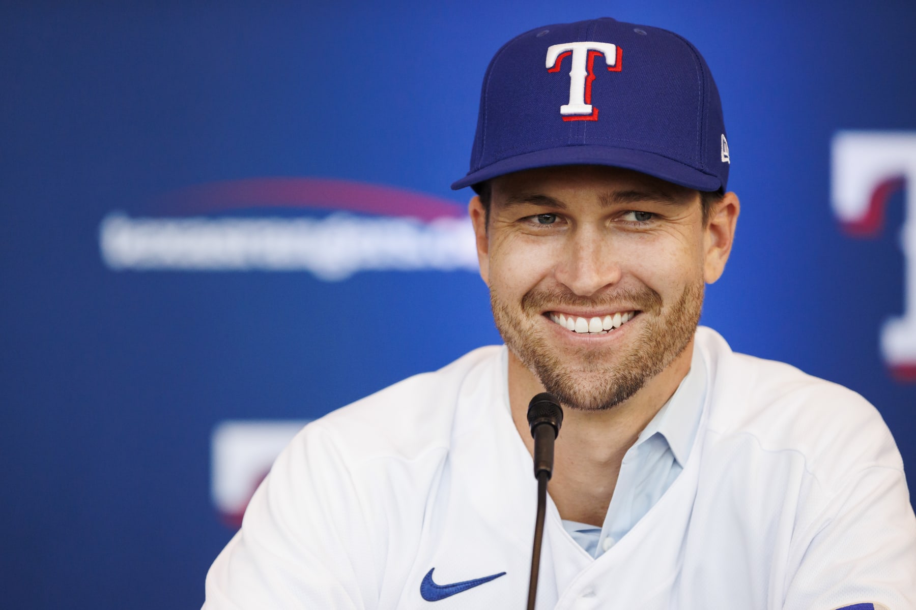 ARLINGTON, TX - DECEMBER 08: Jacob deGrom #48 of the Texas Rangers reacts at an introductory press conference at Globe Life Field on December 8, 2022 in Arlington, Texas. (Photo by Ben Ludeman/Texas Rangers/Getty Images)