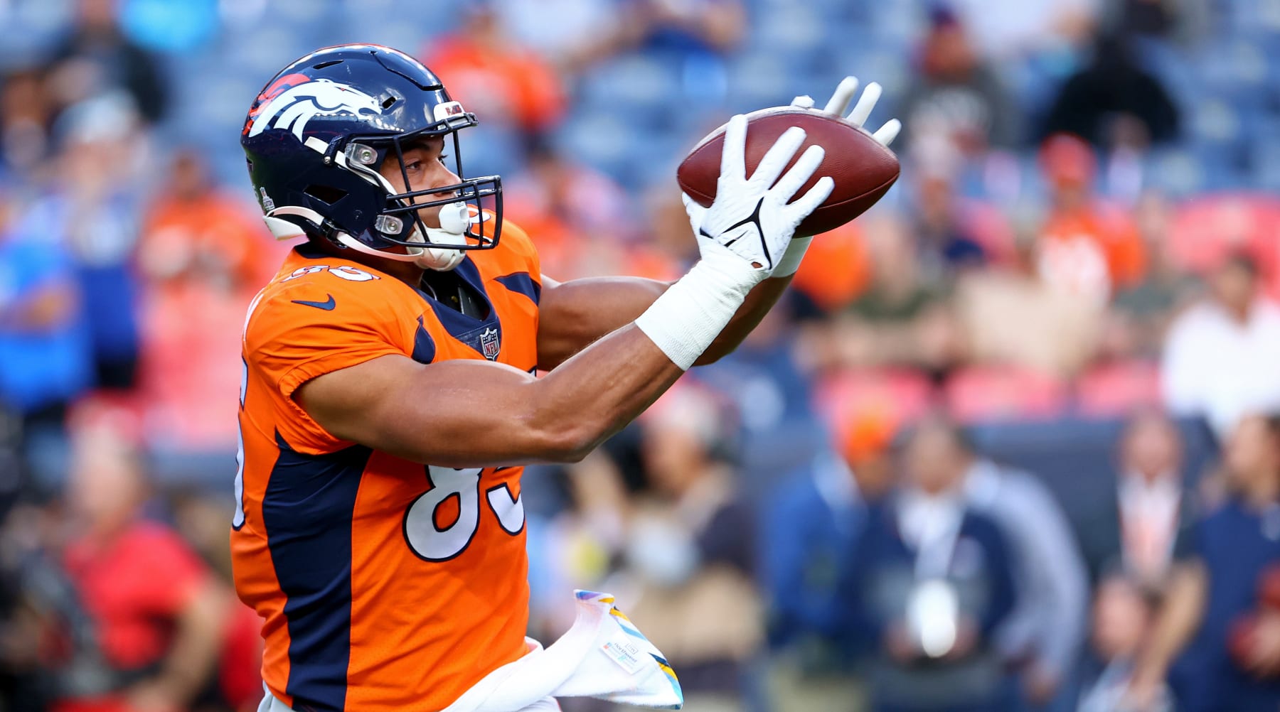 DENVER, COLORADO - OCTOBER 06: Albert Okwuegbunam #85 of the Denver Broncos warms up during a game against the Indianapolis Colts at Empower Field At Mile High on October 06, 2022 in Denver, Colorado. (Photo by Justin Tafoya/Getty Images)