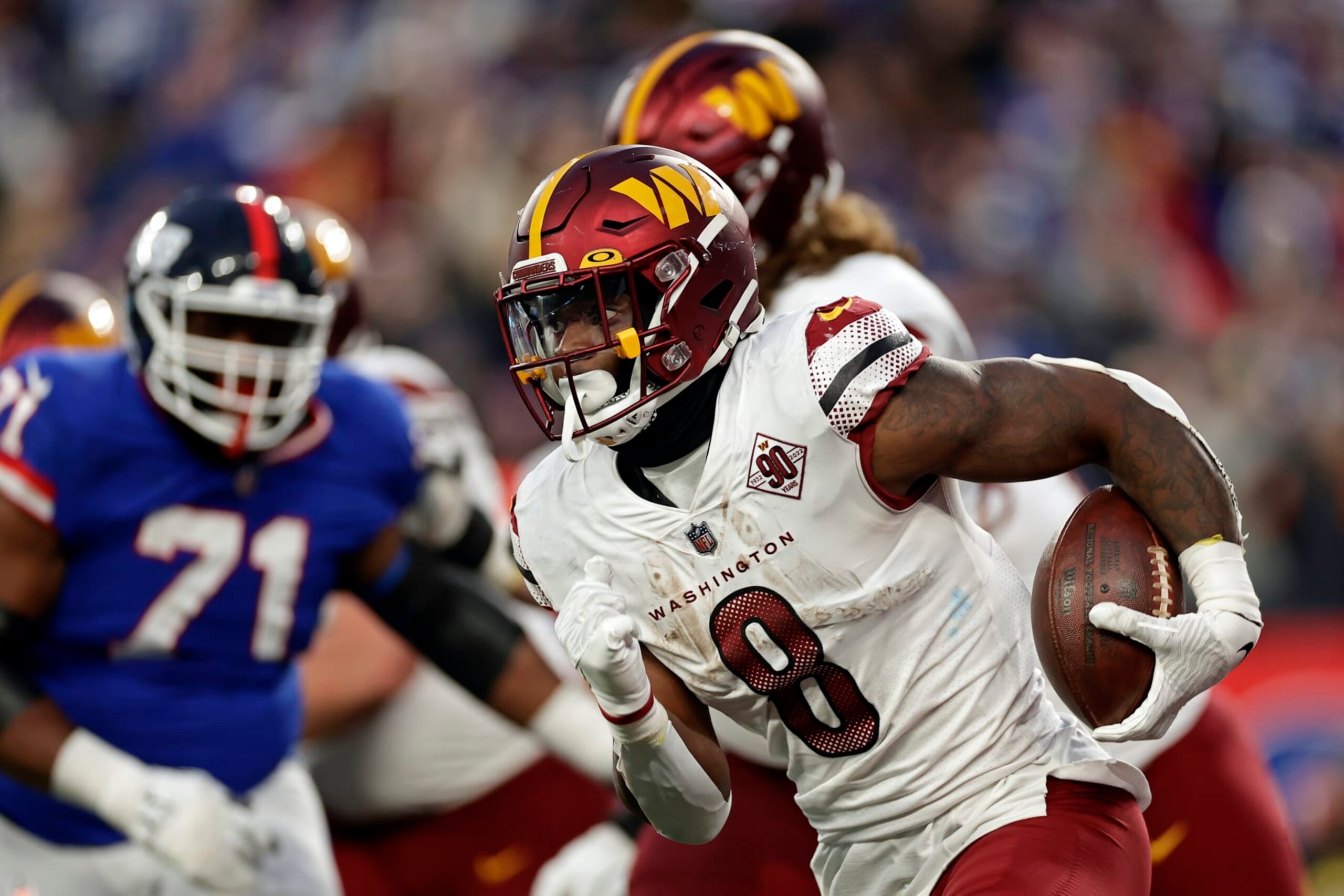 Washington Commanders running back Brian Robinson Jr. (8) runs with the ball against the New York Giants during an NFL football game Sunday, Dec. 4, 2022, in East Rutherford, N.J. (AP Photo/Adam Hunger)