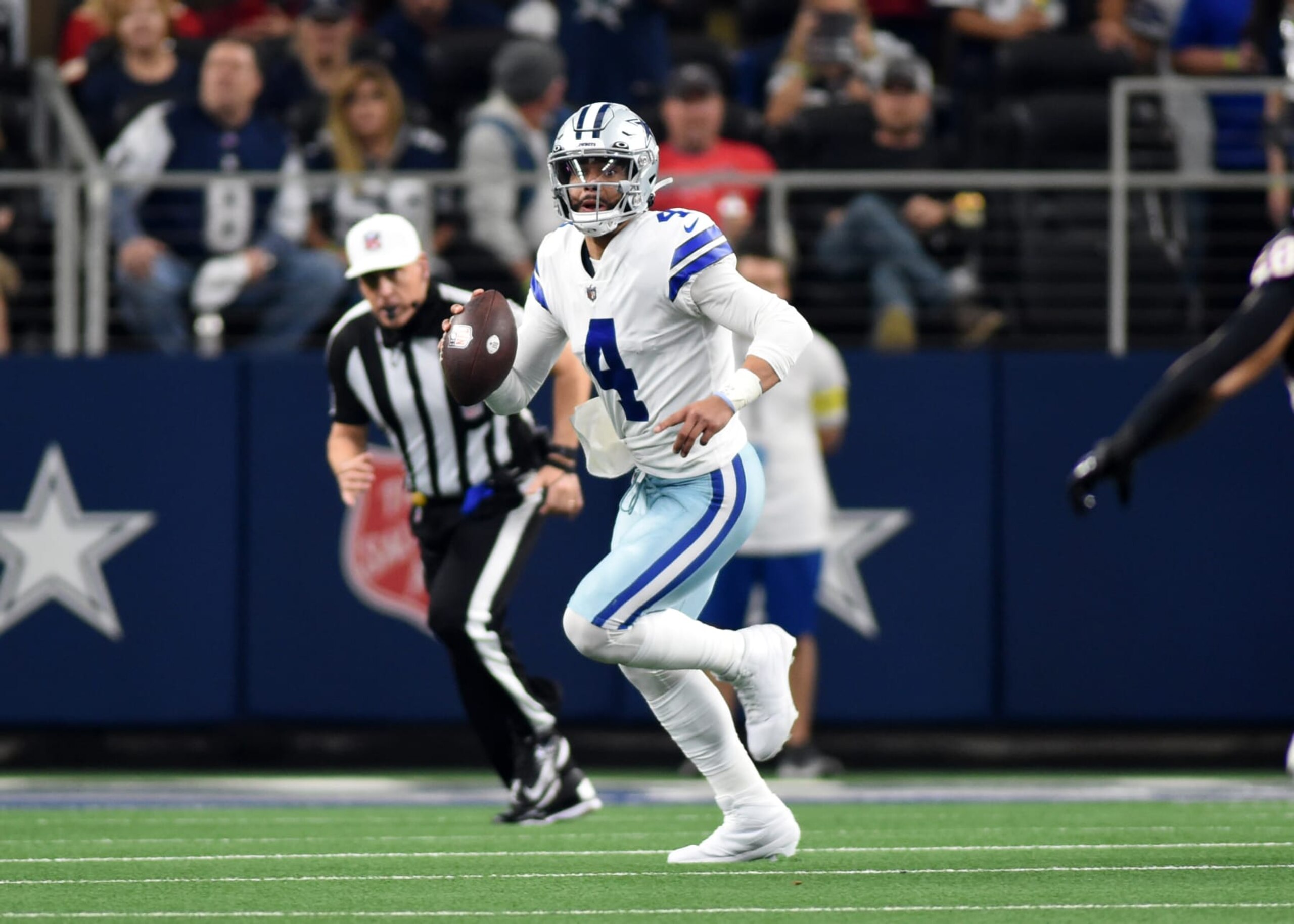 ARLINGTON, TX - DECEMBER 11: Dallas Cowboys QB Dak Prescott looks for an open man during the game featuring the Houston Texans and the Dallas Cowboys on December 11, 2022 at AT&T Stadium in Arlington, TX. (Photo by John Rivera/Icon Sportswire via Getty Images)