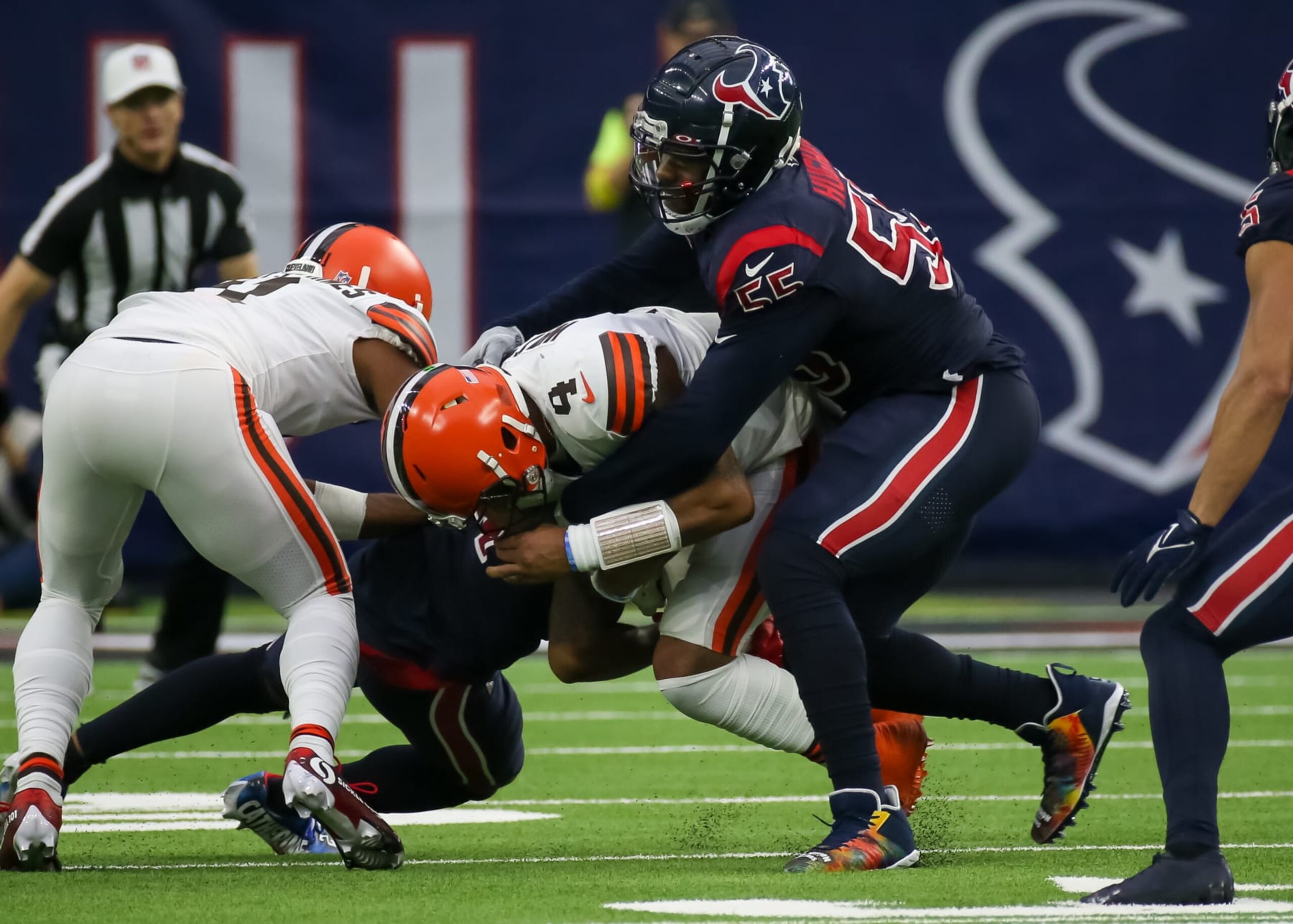 HOUSTON, TX - DECEMBER 04:  Houston Texans defensive end Jerry Hughes (55) tackles Cleveland Browns quarterback Deshaun Watson (4) in the fourth quarter during the NFL game between the Cleveland Browns and Houston Texans on December 4, 2022 at NRG Stadium in Houston, Texas.  (Photo by Leslie Plaza Johnson/Icon Sportswire via Getty Images)