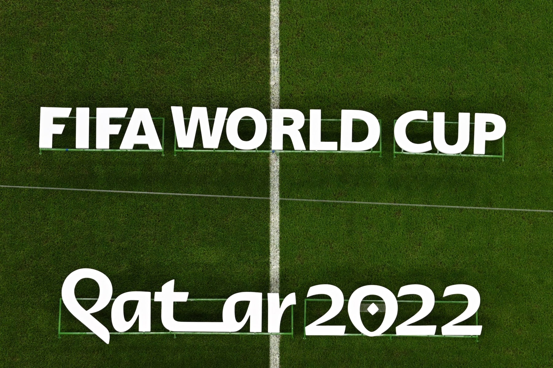 The Fifa World Cup Qatar 2022 logo is displayed on the pitch before the start of the Qatar 2022 World Cup round of 16 football match between France and Poland at the Al-Thumama Stadium in Doha on December 4, 2022. (Photo by MANAN VATSYAYANA / AFP) (Photo by MANAN VATSYAYANA/AFP via Getty Images)