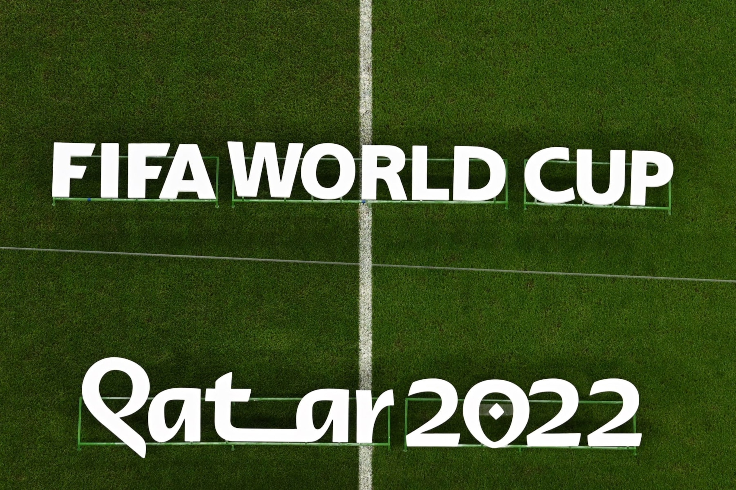 The Fifa World Cup Qatar 2022 logo is displayed on the pitch before the start of the Qatar 2022 World Cup round of 16 football match between France and Poland at the Al-Thumama Stadium in Doha on December 4, 2022. (Photo by MANAN VATSYAYANA / AFP) (Photo by MANAN VATSYAYANA/AFP via Getty Images)