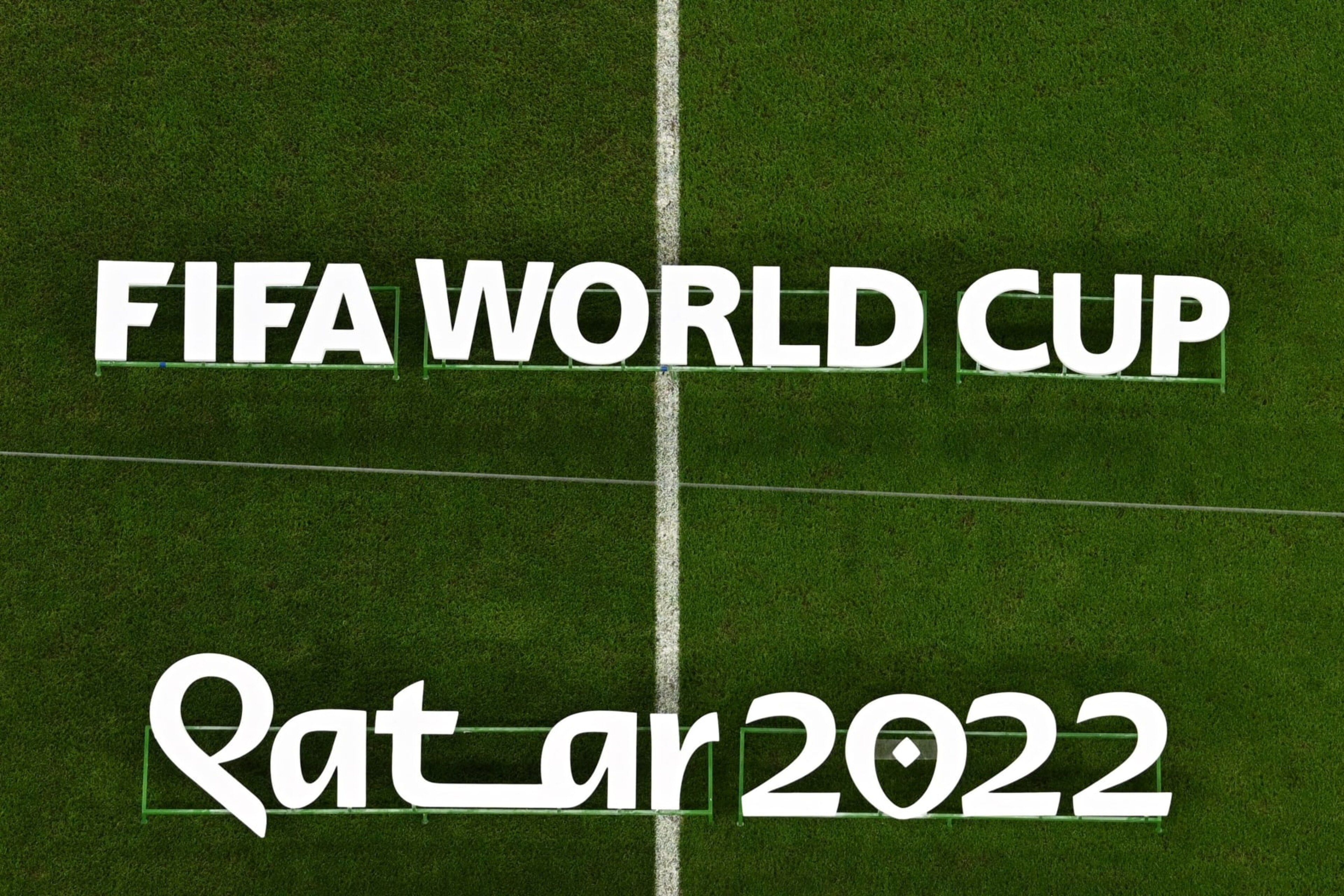 The Fifa World Cup Qatar 2022 logo is displayed on the pitch before the start of the Qatar 2022 World Cup round of 16 football match between France and Poland at the Al-Thumama Stadium in Doha on December 4, 2022. (Photo by MANAN VATSYAYANA / AFP) (Photo by MANAN VATSYAYANA/AFP via Getty Images)