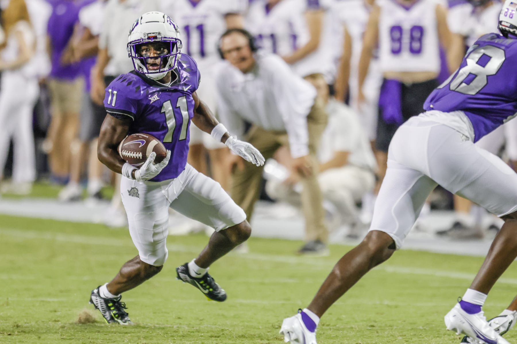 FORT WORTH, TX - SEPTEMBER 10: TCU Horned Frogs wide receiver Derius Davis (11) runs after a catch during the game between the Tarleton State Texans and the TCU Horned Frogs on September 10, 2022 at Amon G. Carter Stadium in Fort Worth, Texas. (Photo by Matthew Pearce/Icon Sportswire via Getty Images)