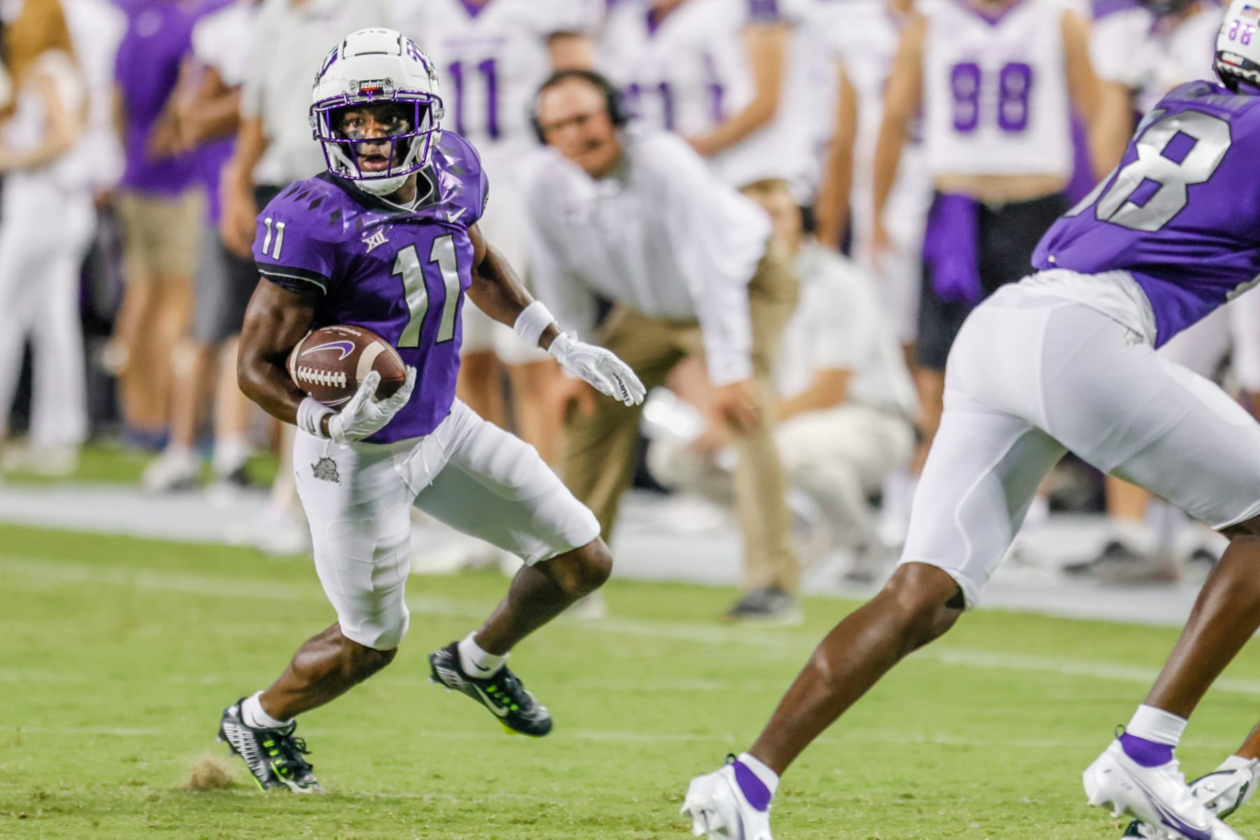 FORT WORTH, TX - SEPTEMBER 10: TCU Horned Frogs wide receiver Derius Davis (11) runs after a catch during the game between the Tarleton State Texans and the TCU Horned Frogs on September 10, 2022 at Amon G. Carter Stadium in Fort Worth, Texas. (Photo by Matthew Pearce/Icon Sportswire via Getty Images) FORT WORTH, TX - SEPTEMBER 10: TCU Horned Frogs wide receiver Derius Davis (11) runs after a catch during the game between the Tarleton State Texans and the TCU Horned Frogs on September 10, 2022 at Amon G. Carter Stadium in Fort Worth, Texas. (Photo by Matthew Pearce/Icon Sportswire via Getty Images)
