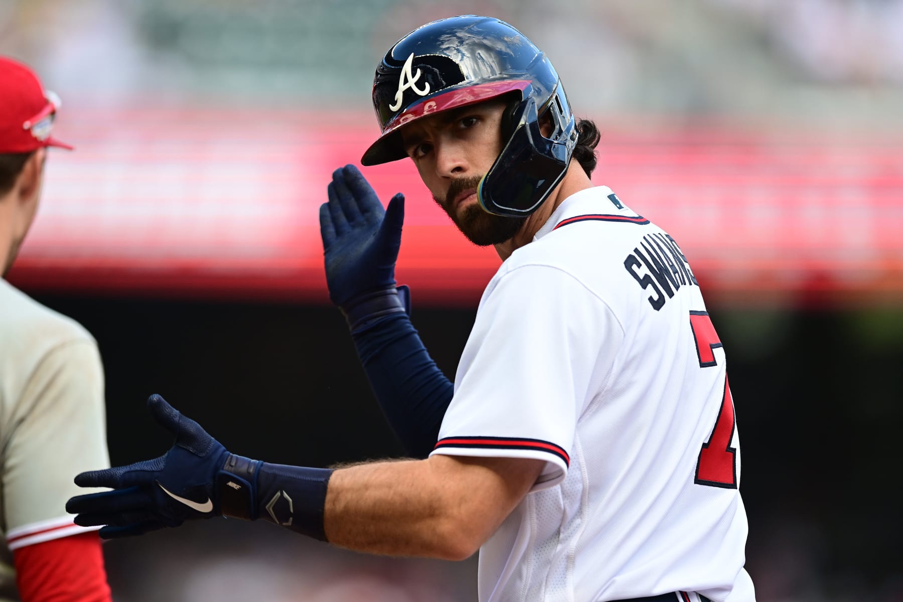 ATLANTA, GEORGIA - OCTOBER 11: Dansby Swanson #7 of the Atlanta Braves reacts after a hit against the Philadelphia Phillies during the ninth inning in game one of the National League Division Series at Truist Park on October 11, 2022 in Atlanta, Georgia. (Photo by Adam Hagy/Getty Images)