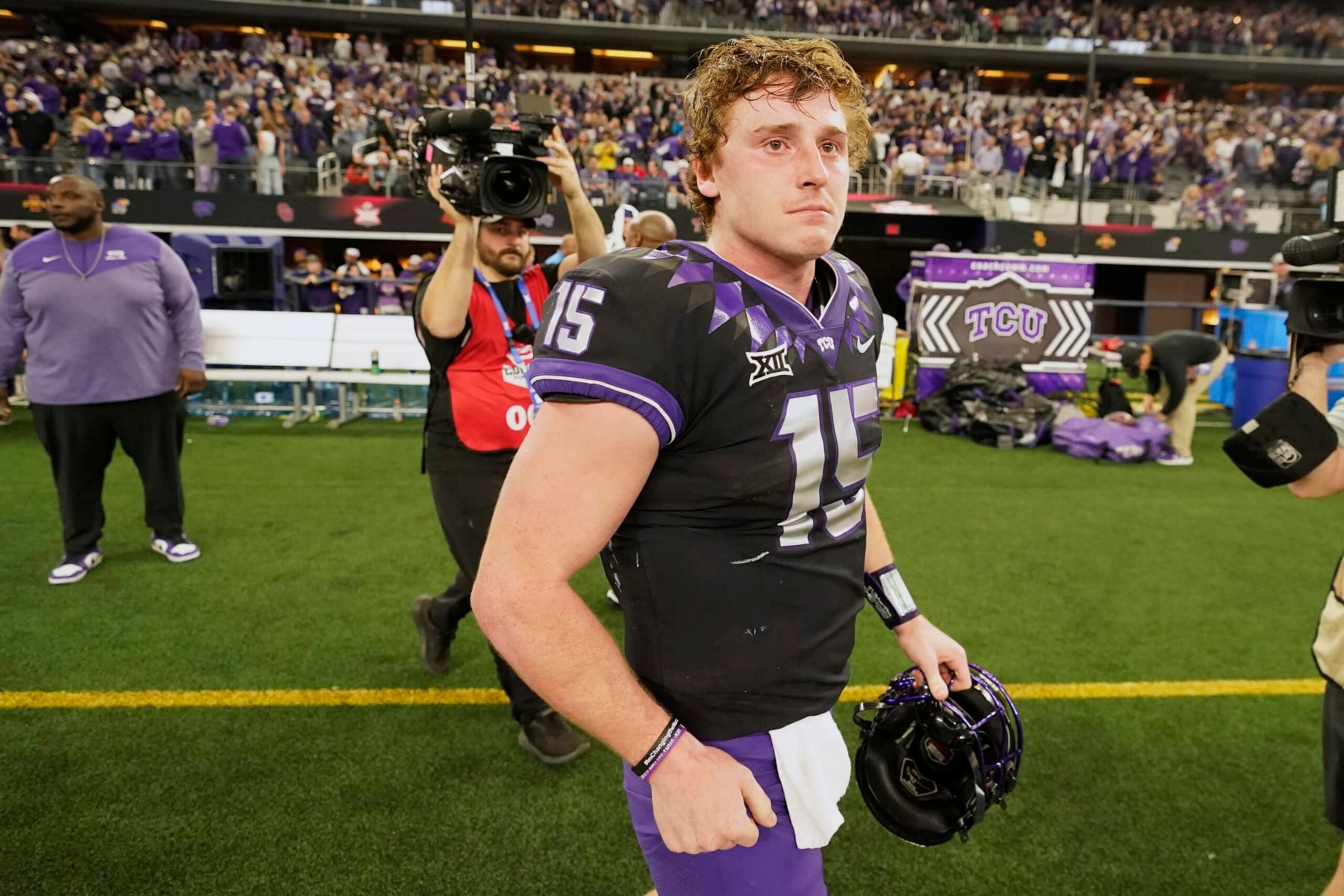 TCU quarterback Max Duggan (15) walks off the field after Kansas State defeated TCU in the Big 12 Conference championship NCAA college football game, Saturday, Dec. 3, 2022, in Arlington, Texas. (AP Photo/LM Otero) TCU quarterback Max Duggan (15) walks off the field after Kansas State defeated TCU in the Big 12 Conference championship NCAA college football game, Saturday, Dec. 3, 2022, in Arlington, Texas. (AP Photo/LM Otero)