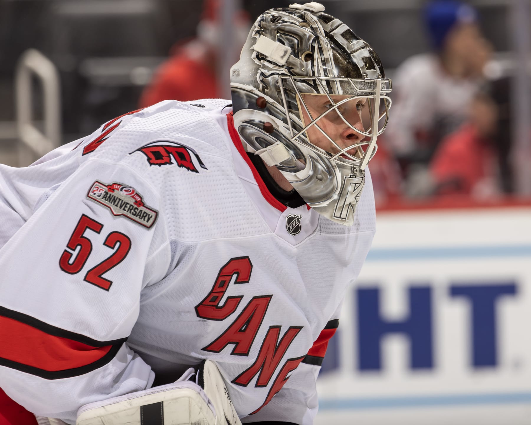 DETROIT, MI - DECEMBER 13: Pyotr Kochetkov #52 of the Carolina Hurricanes looks down the ice against the Detroit Red Wings during the third period of an NHL game at Little Caesars Arena on December 13, 2022 in Detroit, Michigan. Carolina defeated Detroit 1-0. (Photo by Dave Reginek/NHLI via Getty Images)