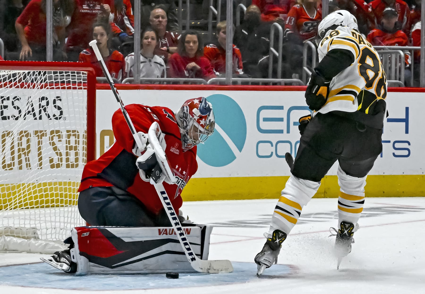 WASHINGTON, DC - OCTOBER 12: Washington Capitals goaltender Darcy Kuemper (35) makes a save on shot by Boston Bruins right wing David Pastrnak (88) during the Boston Bruins game versus the Washington Capitals on October 12, 2022 at the Capital One Arena in Washington, D.C.  (Photo by Mark Goldman/Icon Sportswire via Getty Images)