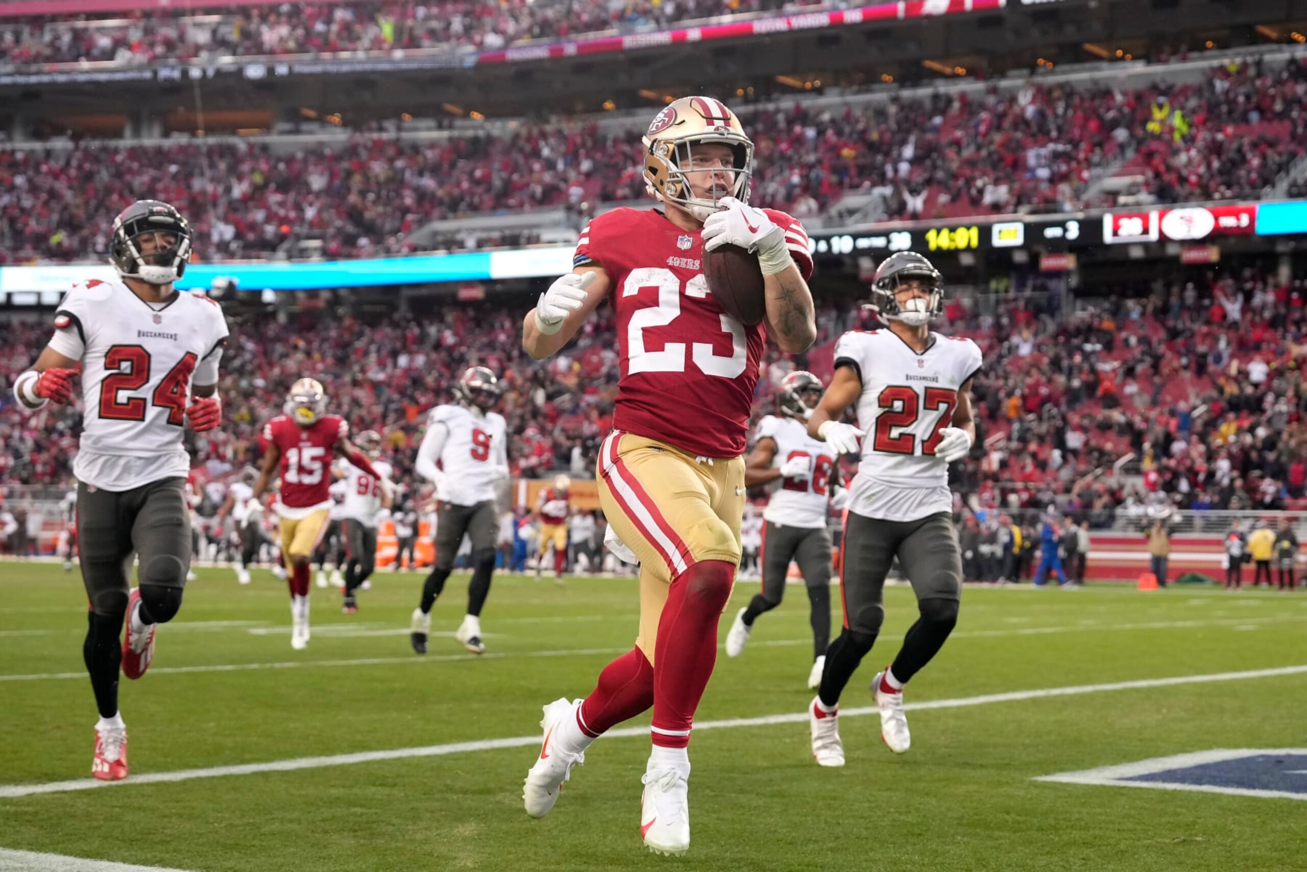 San Francisco 49ers running back Christian McCaffrey (23) runs for a touchdown during the second half of an NFL football game against the Tampa Bay Buccaneers in Santa Clara, Calif., Sunday, Dec. 11, 2022. (AP Photo/Tony Avelar)