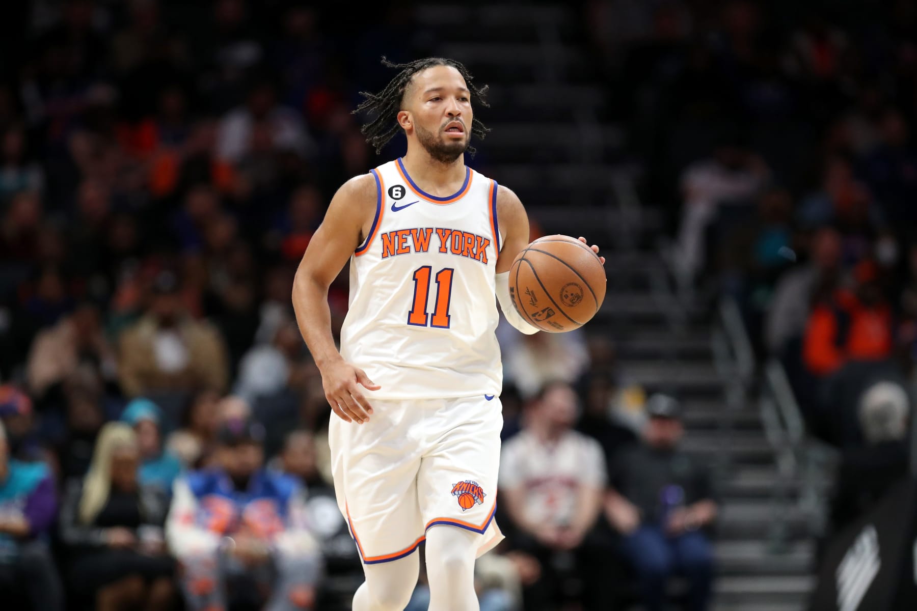 CHARLOTTE, NORTH CAROLINA - DECEMBER 09: Jalen Brunson #11 of the New York Knicks brings the ball up court during the third quarter of the game against the Charlotte Hornets at Spectrum Center on December 09, 2022 in Charlotte, North Carolina. NOTE TO USER: User expressly acknowledges and agrees that, by downloading and or using this photograph, User is consenting to the terms and conditions of the Getty Images License Agreement. (Photo by David Jensen/Getty Images)