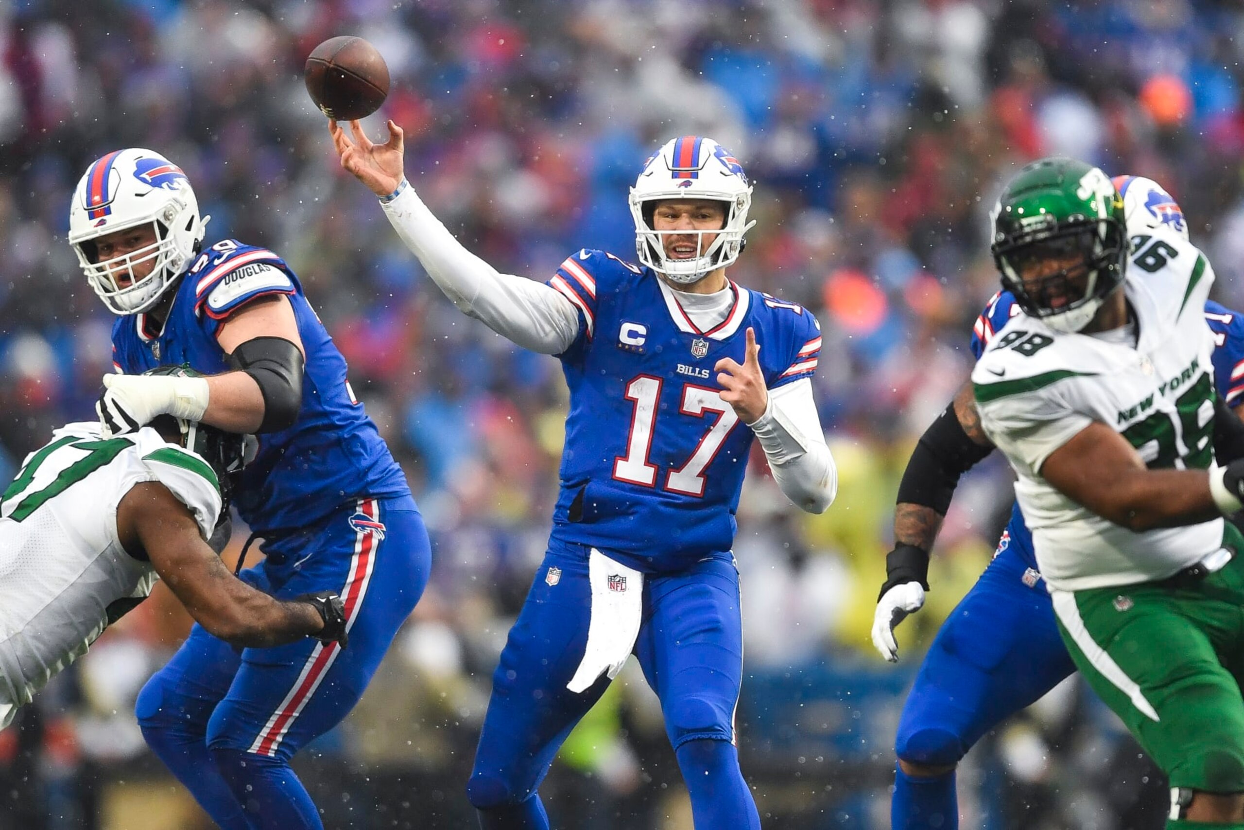 Buffalo Bills quarterback Josh Allen (17) throws a pass during the first half of an NFL football game against the New York Jets in Orchard Park, N.Y., Sunday, Dec. 11, 2022. (AP Photo/Adrian Kraus)