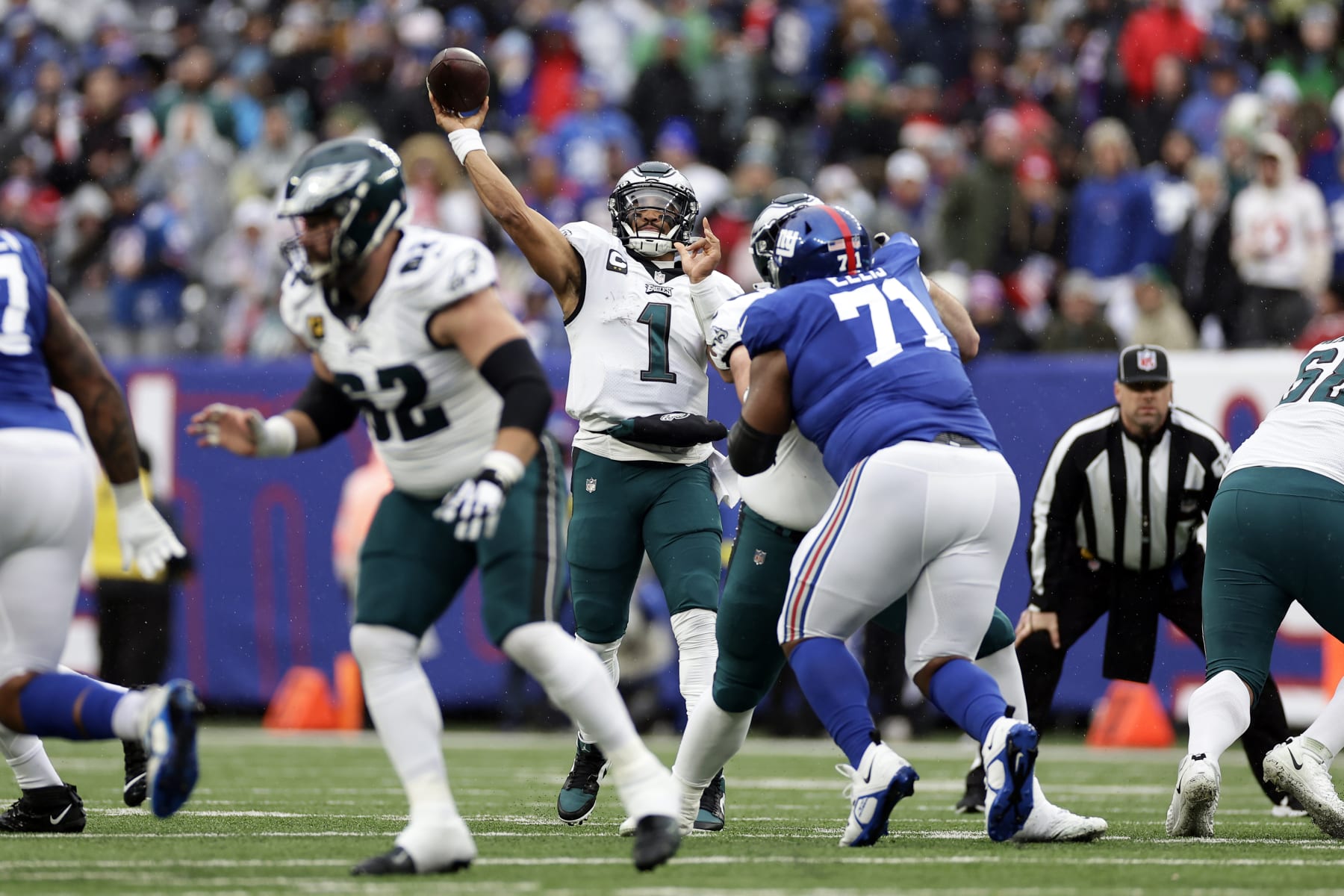 Philadelphia Eagles quarterback Jalen Hurts (1) passes against the New York Giants during an NFL football game Sunday, Dec. 11, 2022, in East Rutherford, N.J. (AP Photo/Adam Hunger)
