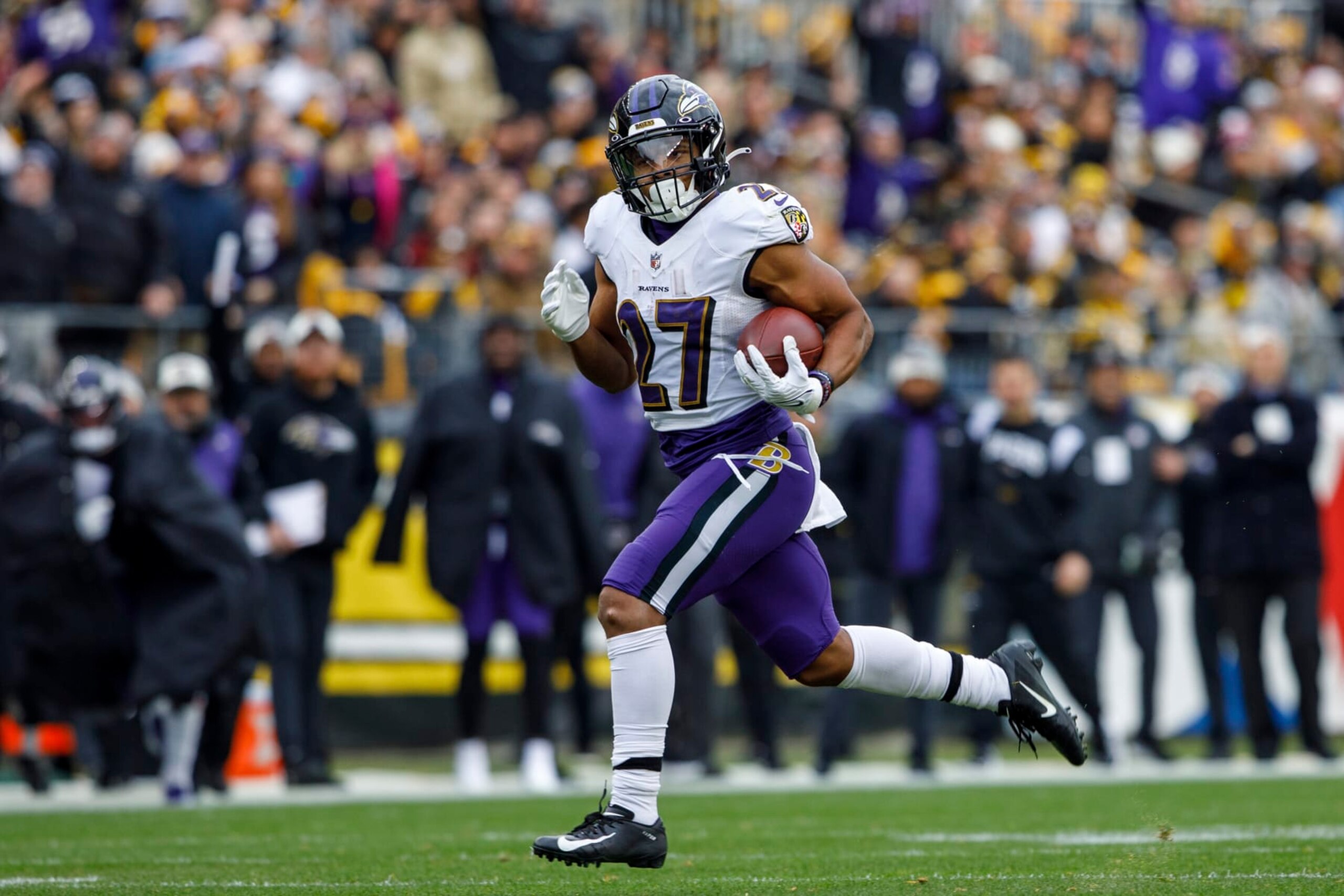 Baltimore Ravens running back J.K. Dobbins (27) breaks free for a 44-yard rush during an NFL football game, Sunday, Dec. 11, 2022, in Pittsburgh, PA. (AP Photo/Matt Durisko)