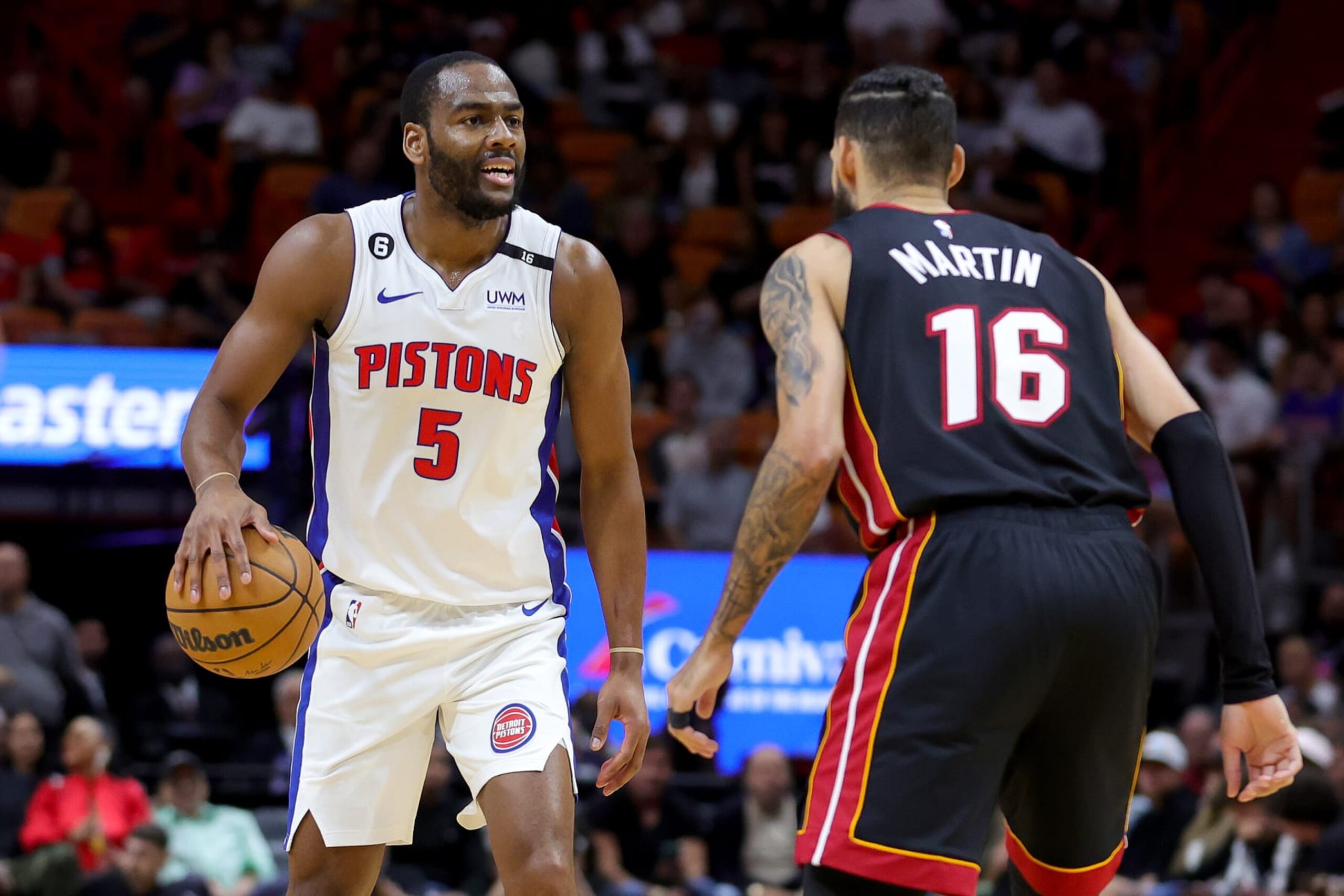MIAMI, FLORIDA - DECEMBER 06: Alec Burks #5 of the Detroit Pistons dribbles against Caleb Martin #16 of the Miami Heat during the second quarter at FTX Arena on December 06, 2022 in Miami, Florida. NOTE TO USER: User expressly acknowledges and agrees that, by downloading and or using this photograph, User is consenting to the terms and conditions of the Getty Images License Agreement. (Photo by Megan Briggs/Getty Images)