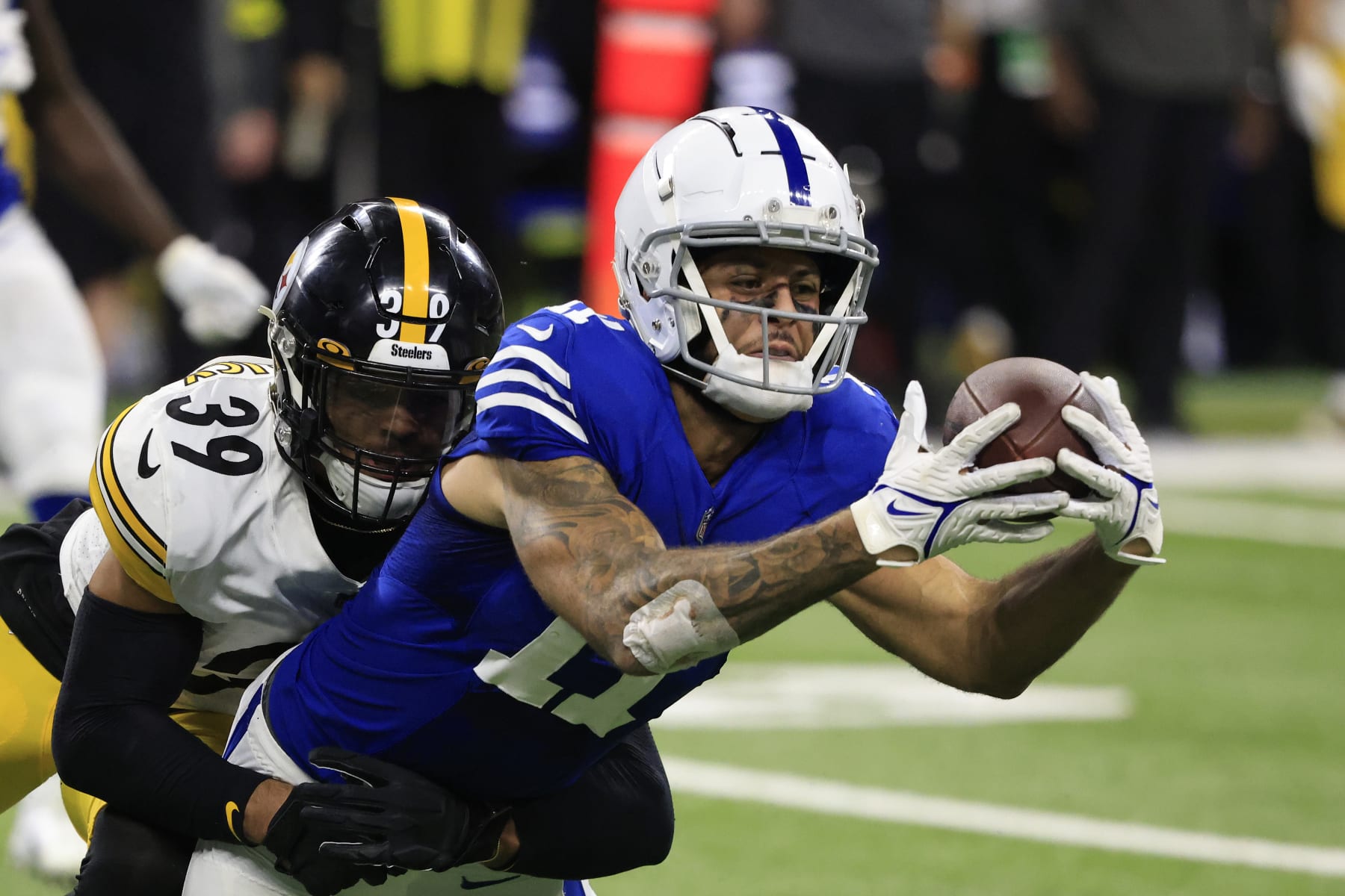 INDIANAPOLIS, INDIANA - NOVEMBER 28: Michael Pittman Jr. #11 of the Indianapolis Colts is tackled by Minkah Fitzpatrick #39 of the Pittsburgh Steelers at Lucas Oil Stadium on November 28, 2022 in Indianapolis, Indiana. (Photo by Justin Casterline/Getty Images)