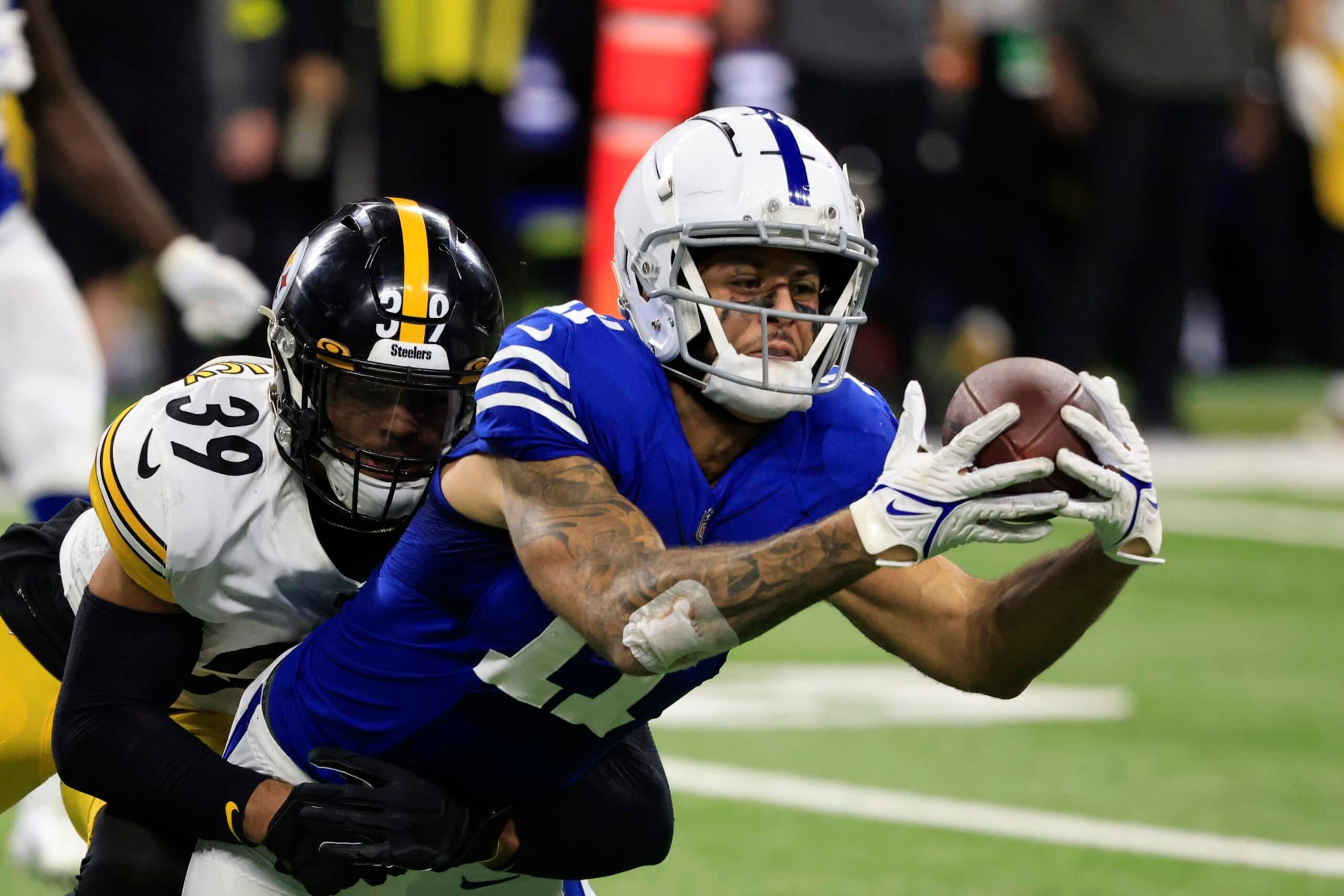 INDIANAPOLIS, INDIANA - NOVEMBER 28: Michael Pittman Jr. #11 of the Indianapolis Colts is tackled by Minkah Fitzpatrick #39 of the Pittsburgh Steelers at Lucas Oil Stadium on November 28, 2022 in Indianapolis, Indiana. (Photo by Justin Casterline/Getty Images)