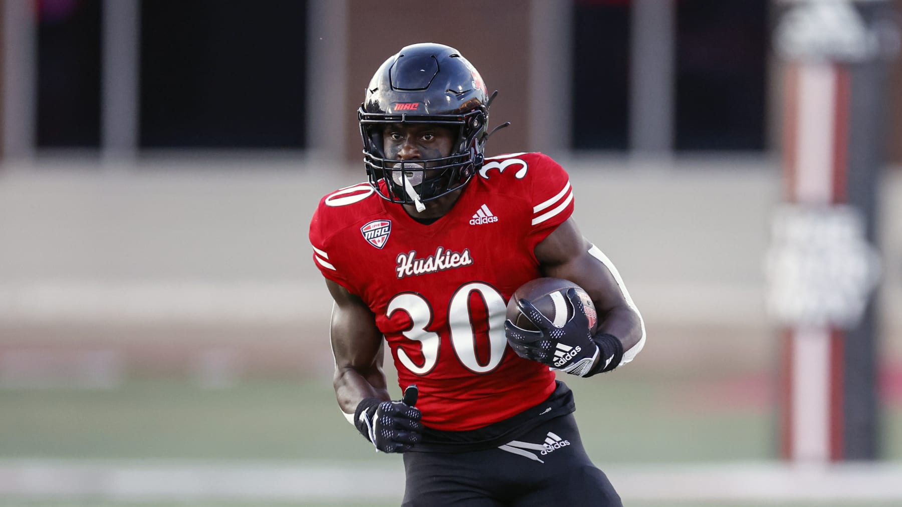 Northern Illinois Huskies running back Harrison Waylee runs with the ball against Eastern Illinois Panthers during the first half of an NCAA football game on Thursday, Sept. 1, 2022, in DeKalb, Ill. (AP Photo/Kamil Krzaczynski)