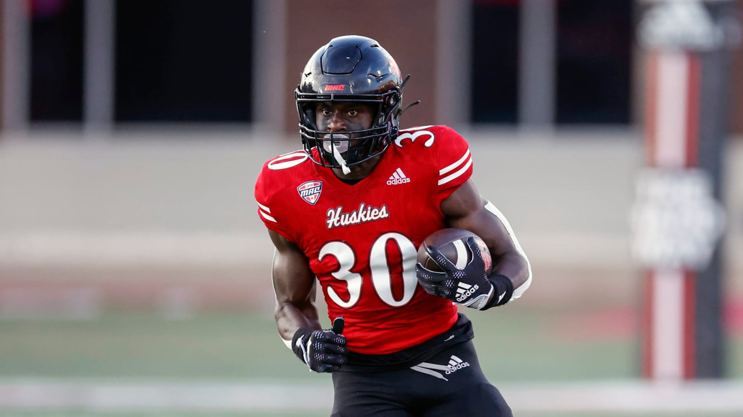 Northern Illinois Huskies running back Harrison Waylee runs with the ball against Eastern Illinois Panthers during the first half of an NCAA football game on Thursday, Sept. 1, 2022, in DeKalb, Ill. (AP Photo/Kamil Krzaczynski)
