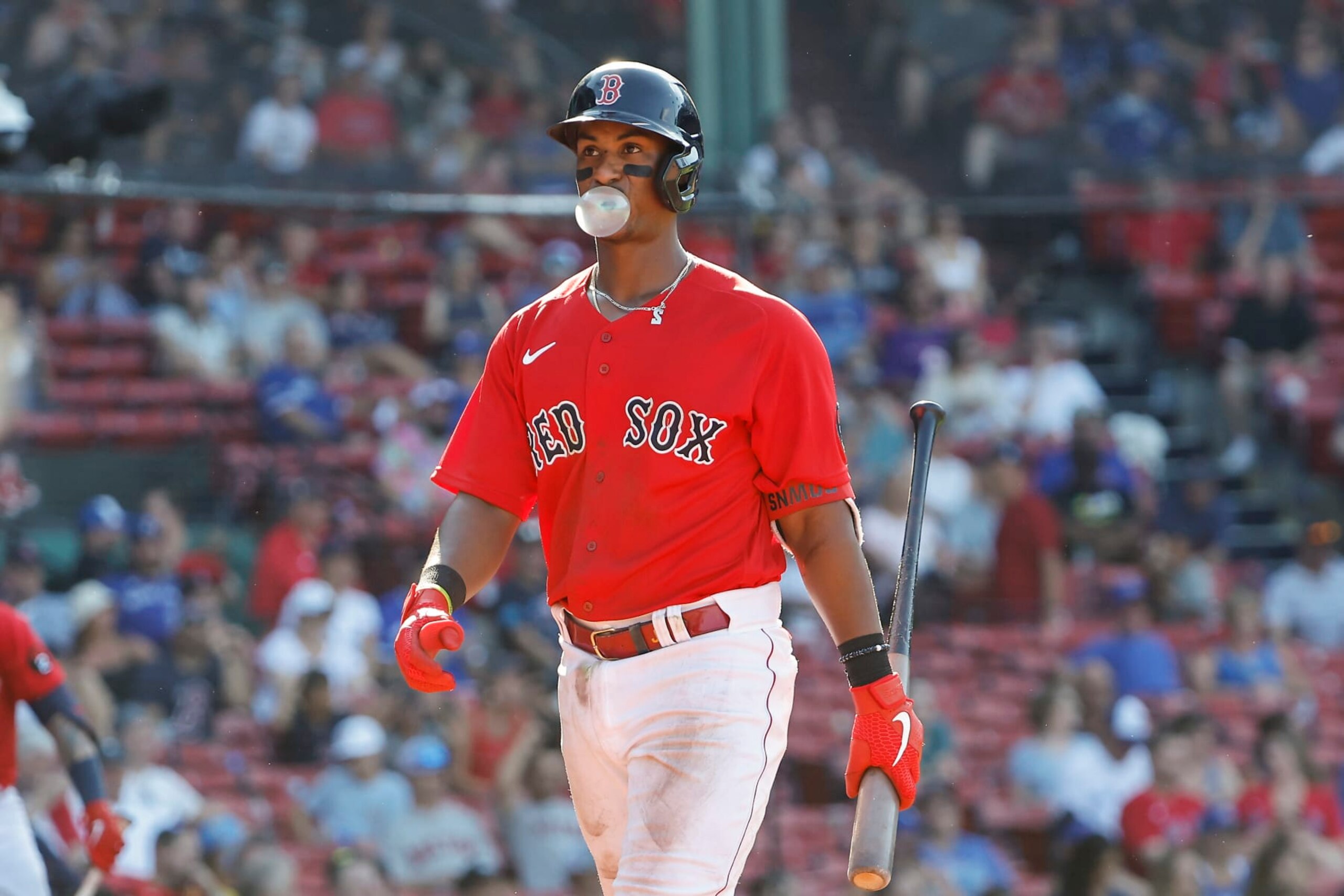 BOSTON, MA - JULY 24: Jeter Downs #20 of the Boston Red Sox blows a bubble on his way back to the dugout after striking out during the ninth inning against the Toronto Blue Jays at Fenway Park on July 24, 2022 in Boston, Massachusetts. (Photo By Winslow Townson/Getty Images)