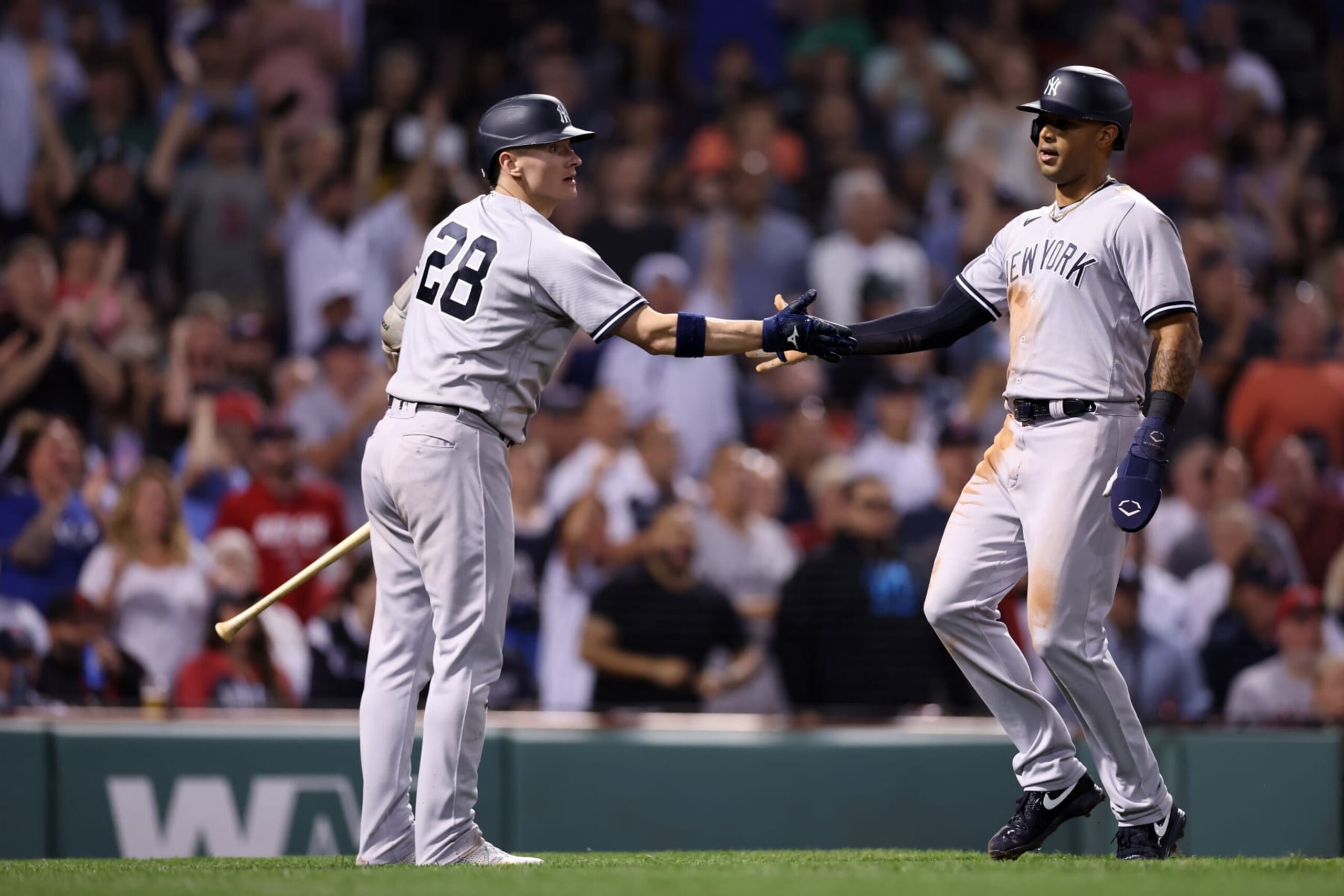 BOSTON, MASSACHUSETTS - SEPTEMBER 14: Aaron Hicks #31 of the New York Yankees celebrates with Josh Donaldson #28 after scoring a run against the Boston Red Sox  the fifth inning at Fenway Park on September 14, 2022 in Boston, Massachusetts. (Photo by Maddie Meyer/Getty Images)