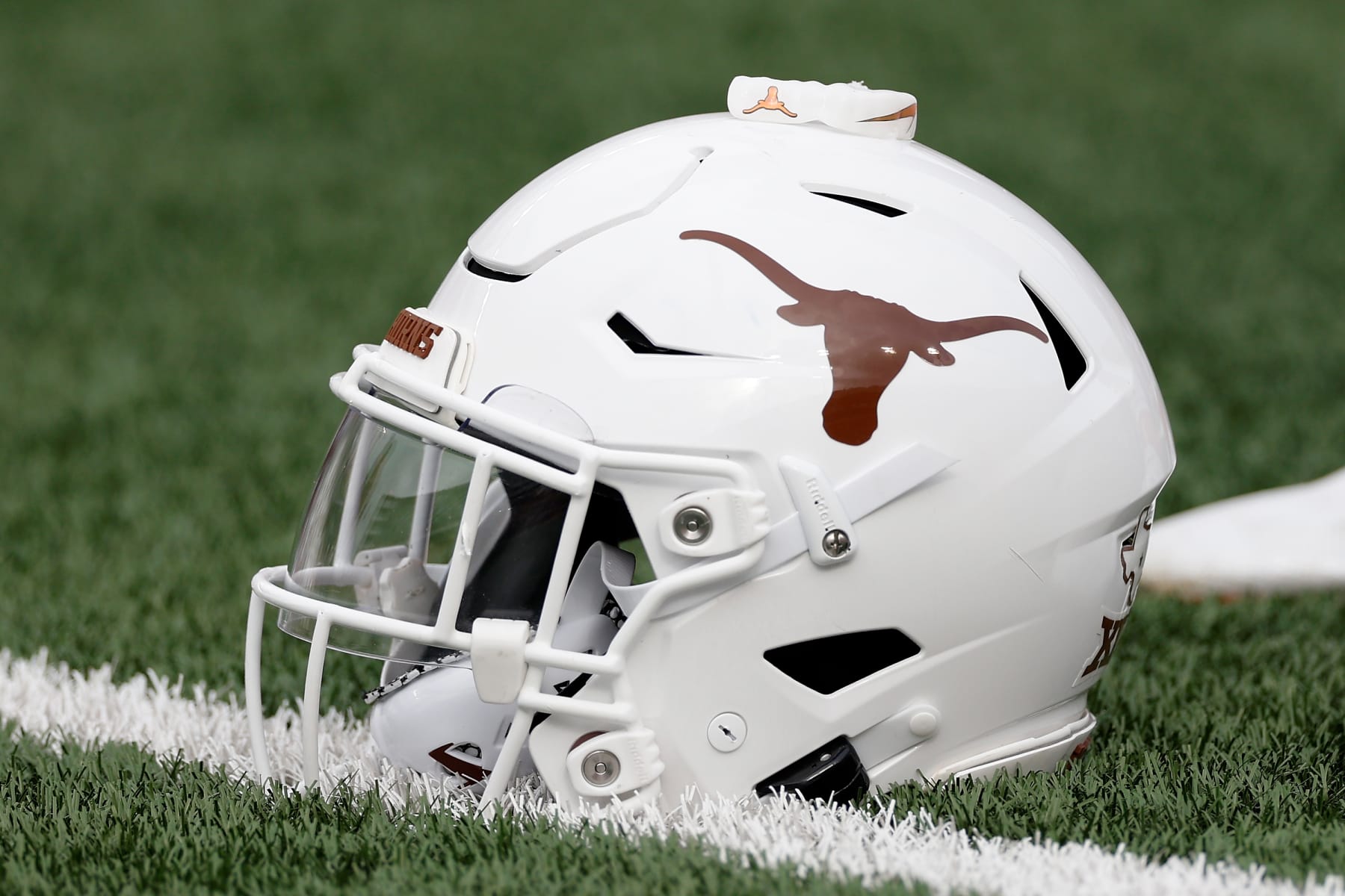 AUSTIN, TEXAS - OCTOBER 15: A Texas Longhorns helmet is seen on the turf before the game against the Iowa State Cyclones at Darrell K Royal-Texas Memorial Stadium on October 15, 2022 in Austin, Texas. (Photo by Tim Warner/Getty Images) AUSTIN, TEXAS - OCTOBER 15: A Texas Longhorns helmet is seen on the turf before the game against the Iowa State Cyclones at Darrell K Royal-Texas Memorial Stadium on October 15, 2022 in Austin, Texas. (Photo by Tim Warner/Getty Images)