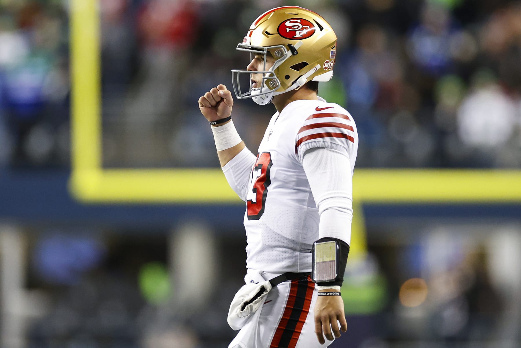 SEATTLE, WASHINGTON - DECEMBER 15: Brock Purdy #13 of the San Francisco 49ers celebrates after a touchdown against the Seattle Seahawks during the third quarter of the game at Lumen Field on December 15, 2022 in Seattle, Washington. (Photo by Steph Chambers/Getty Images)