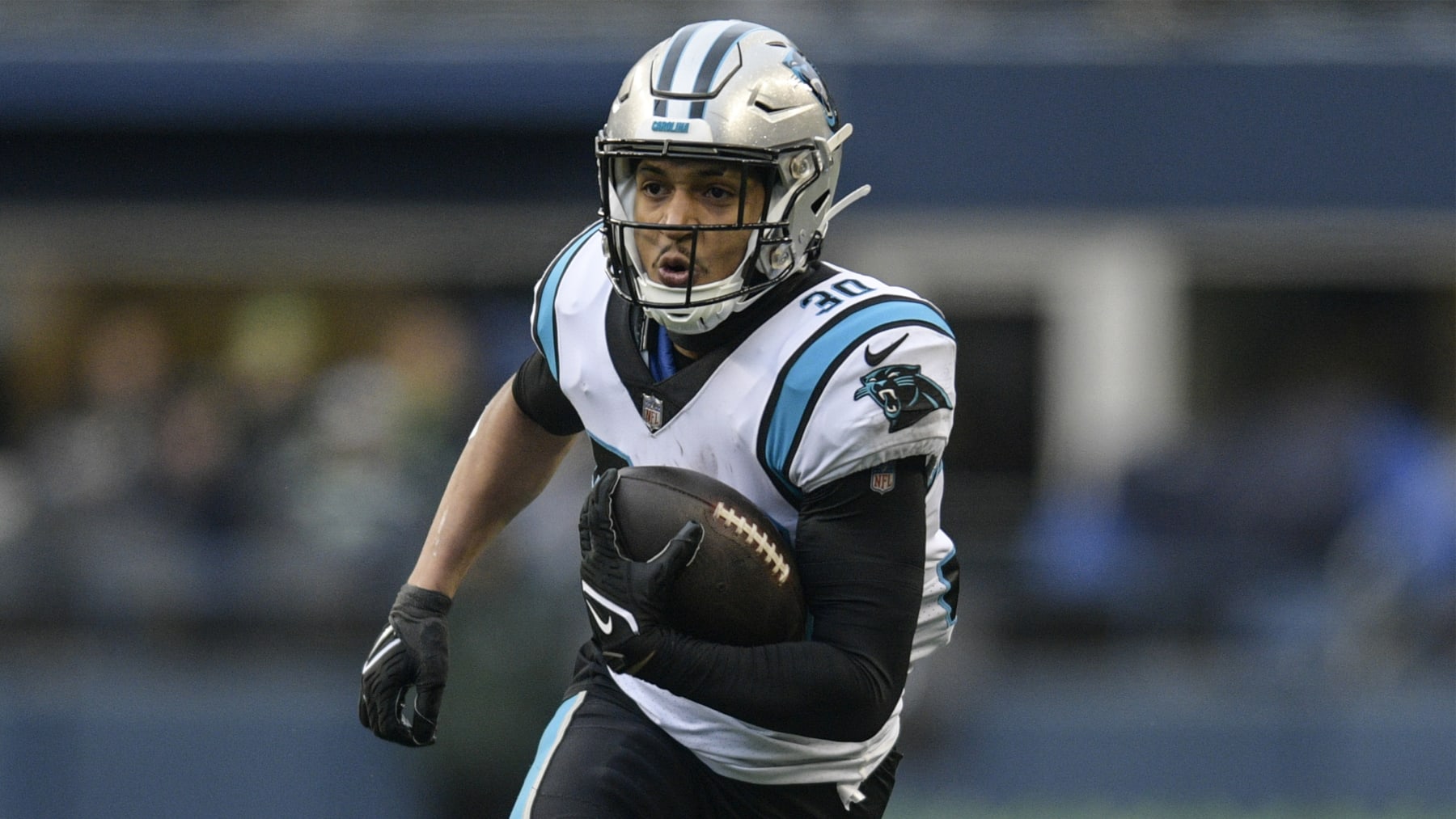 Carolina Panthers running back Chuba Hubbard (30) runs Seattle Seahawks during the first half of an NFL football game, Sunday, Dec. 11, 2022, in Seattle. (AP Photo/Caean Couto)