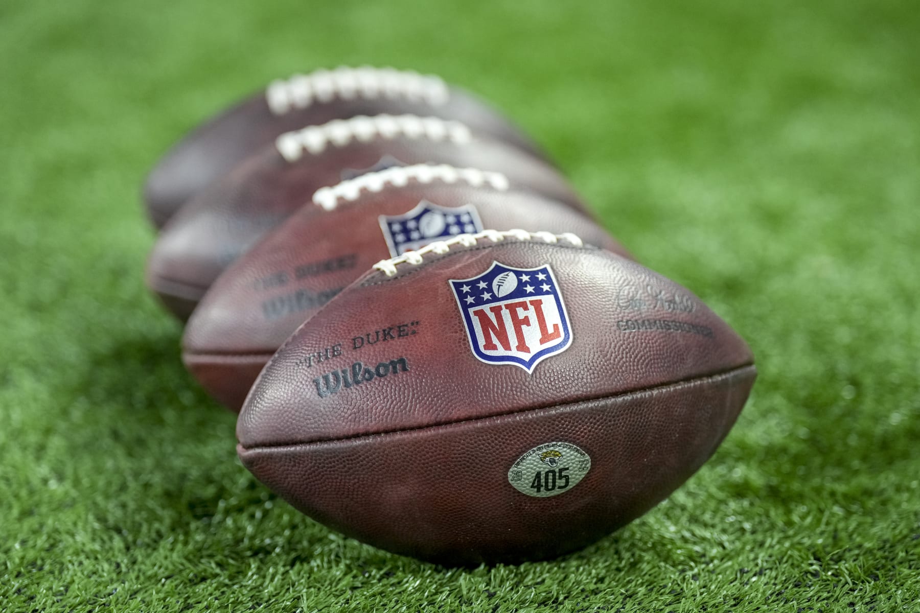 DETROIT, MICHIGAN - DECEMBER 04: Wilson brand footballs are pictured with the NFL logo before the game between the Detroit Lions and Jacksonville Jaguars at Ford Field on December 04, 2022 in Detroit, Michigan. (Photo by Nic Antaya/Getty Images)