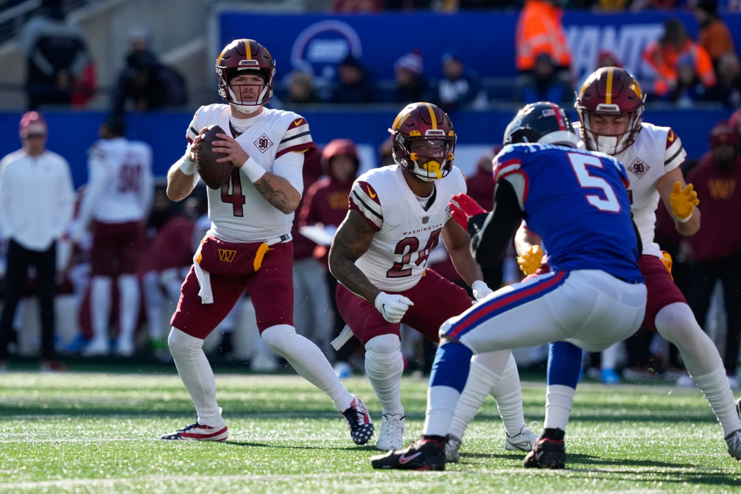 Washington Commanders quarterback Taylor Heinicke (4), left, looks to throw during the first half of an NFL football game against the New York Giants, Sunday, Dec. 4, 2022, in East Rutherford, N.J. (AP Photo/John Minchillo) Washington Commanders quarterback Taylor Heinicke (4), left, looks to throw during the first half of an NFL football game against the New York Giants, Sunday, Dec. 4, 2022, in East Rutherford, N.J. (AP Photo/John Minchillo)
