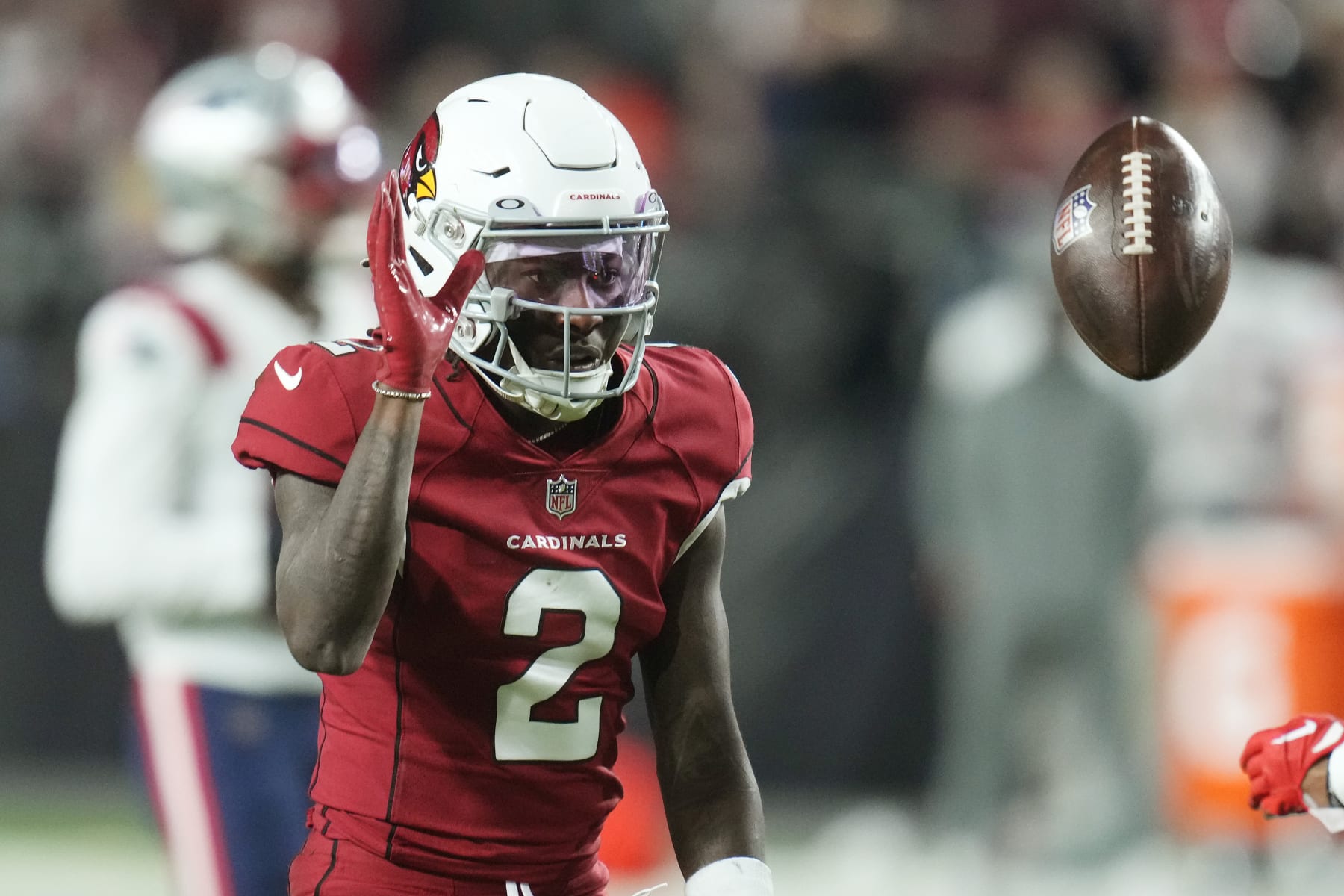 Arizona Cardinals wide receiver Marquise Brown flips the ball back to an official during the first half of an NFL football game against the New England Patriots in Glendale, Ariz., Monday, Dec. 12, 2022. (AP Photo/Ross D. Franklin)