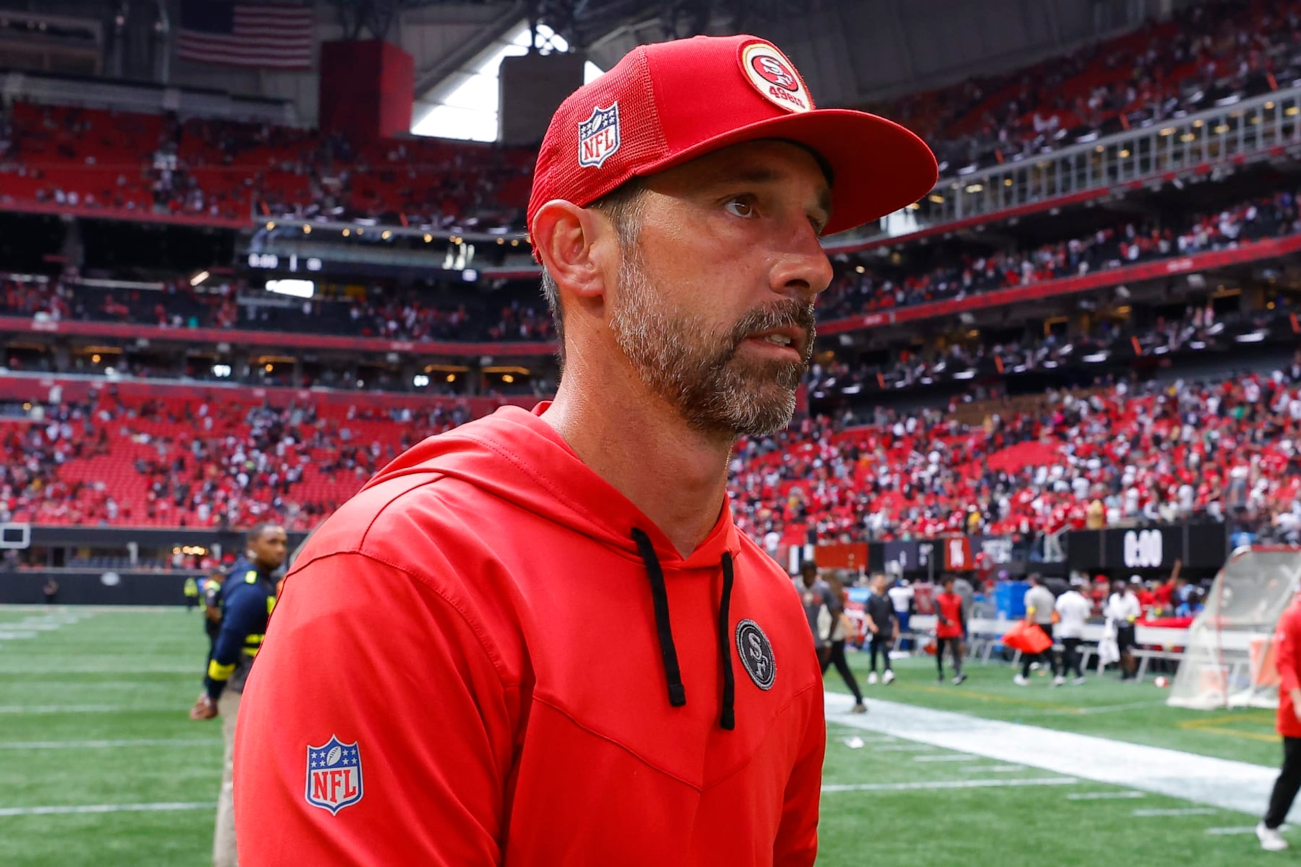 ATLANTA, GA - OCTOBER 16: Head coach Kyle Shanahan of the San Francisco 49ers leaves the field following the game against the Atlanta Falcons at Mercedes-Benz Stadium on October 16, 2022 in Atlanta, Georgia. (Photo by Todd Kirkland/Getty Images)