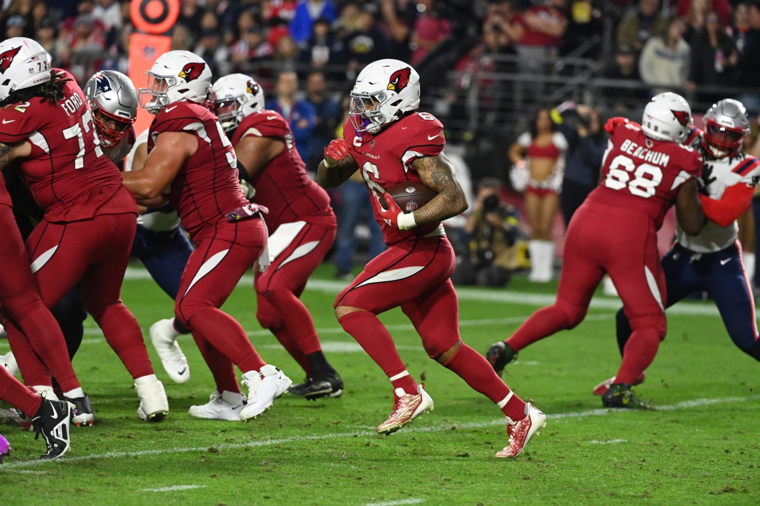 GLENDALE, ARIZONA - DECEMBER 12: James Conner #6 of the Arizona Cardinals runs with the ball against the New England Patriots at State Farm Stadium on December 12, 2022 in Glendale, Arizona. (Photo by Norm Hall/Getty Images)