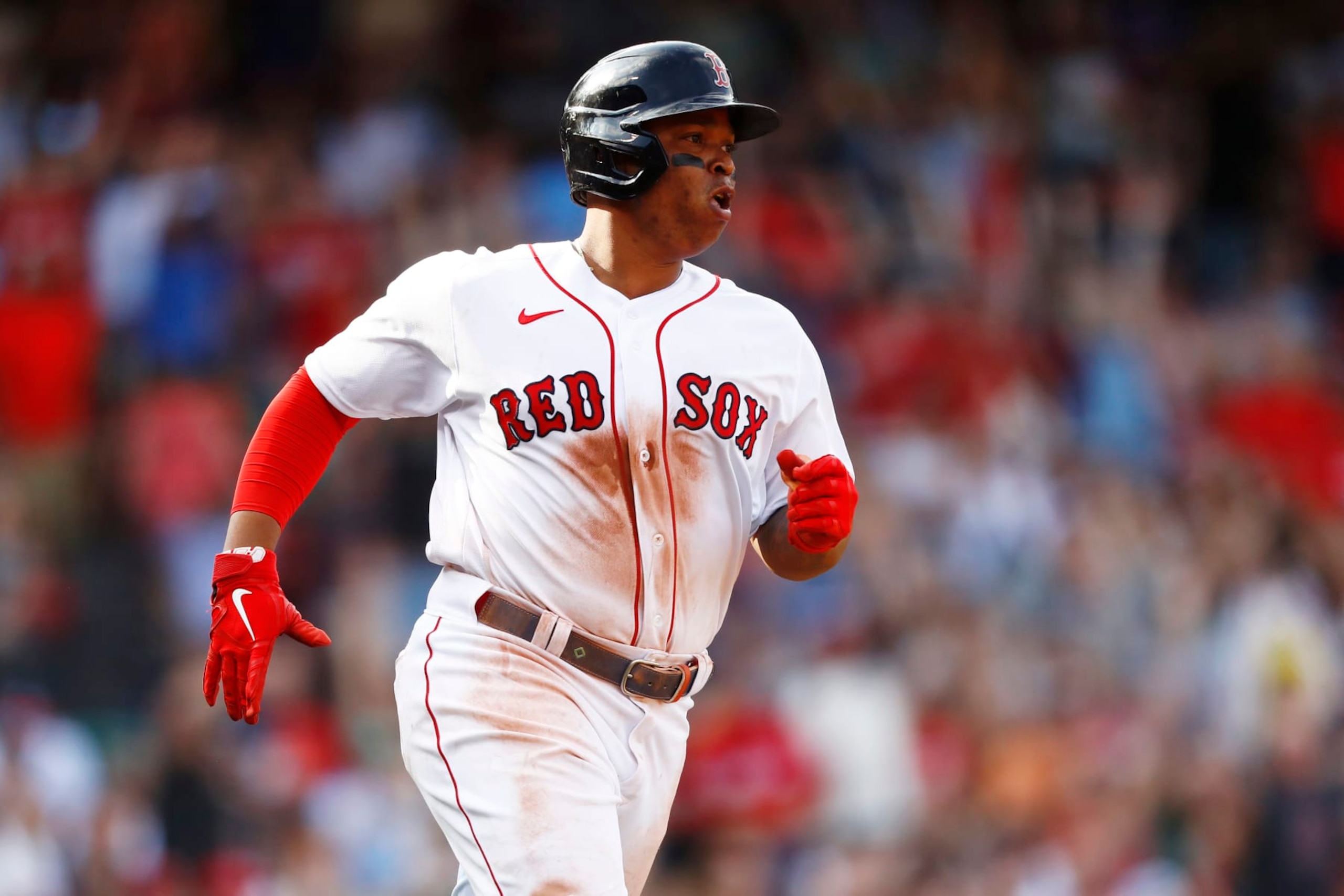 BOSTON, MASSACHUSETTS - SEPTEMBER 18: Rafael Devers #11 of the Boston Red Sox hits a two RBI single in the bottom of the fifth inning of the game against the Kansas City Royals at Fenway Park on September 18, 2022 in Boston, Massachusetts. (Photo by Omar Rawlings/Getty Images)