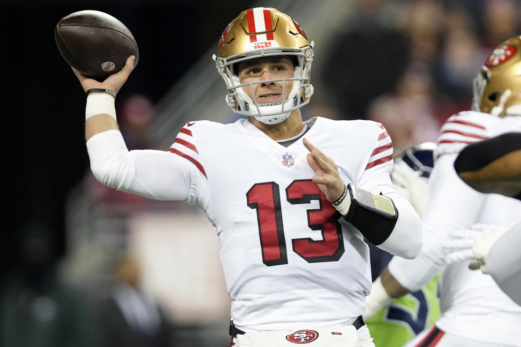 SEATTLE, WASHINGTON - DECEMBER 15: Brock Purdy #13 of the San Francisco 49ers throws a pass against the Seattle Seahawks during the first half at Lumen Field on December 15, 2022 in Seattle, Washington. (Photo by Christopher Mast/Getty Images)