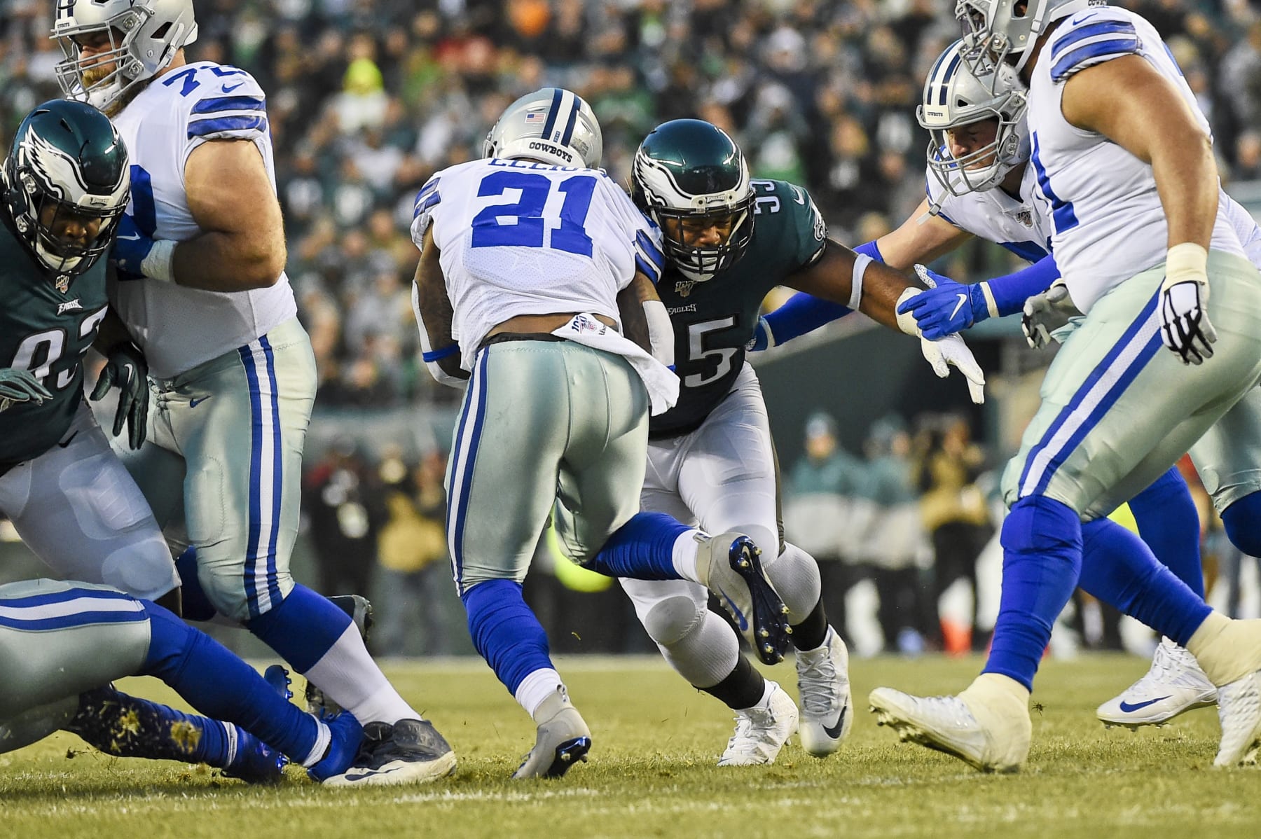 PHILADELPHIA, PA - DECEMBER 22: Philadelphia Eagles Defensive End Brandon Graham (55) stops Dallas Cowboys Running Back Ezekiel Elliott (21) for a loss during the game between the Dallas Cowboys and the Philadelphia Eagle on December 22, 2019, at Lincoln Financial Filed in Philadelphia, PA. (Photo by Andy Lewis/Icon Sportswire via Getty Images)