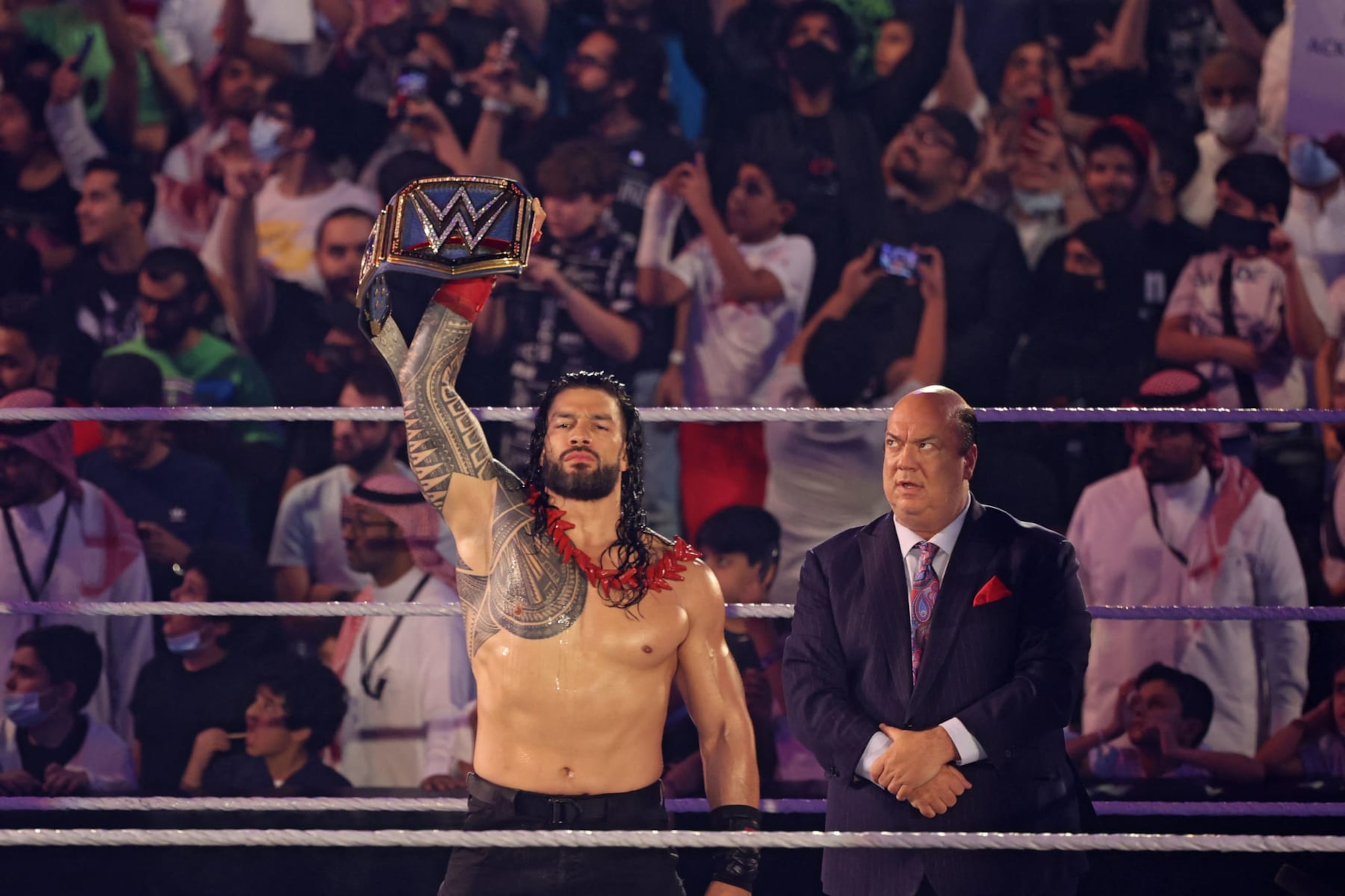 Roman Reigns greets the fans ahead of his match during the World Wrestling Entertainment (WWE) Crown Jewel pay-per-view in the Saudi capital Riyadh on October 21, 2021. (Photo by Fayez Nureldine / AFP) (Photo by FAYEZ NURELDINE/AFP via Getty Images)
