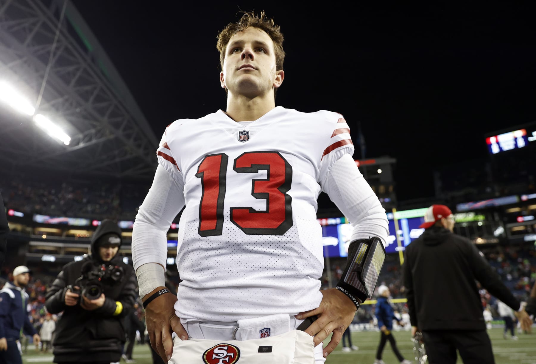 SEATTLE, WASHINGTON - DECEMBER 15: Brock Purdy #13 of the San Francisco 49ers looks on after defeating the Seattle Seahawks at Lumen Field on December 15, 2022 in Seattle, Washington. (Photo by Steph Chambers/Getty Images)