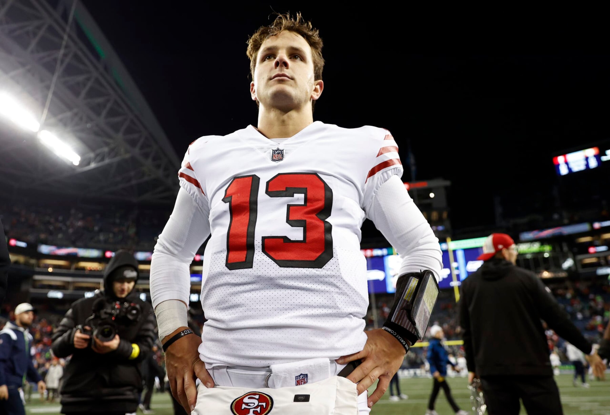 SEATTLE, WASHINGTON - DECEMBER 15: Brock Purdy #13 of the San Francisco 49ers looks on after defeating the Seattle Seahawks at Lumen Field on December 15, 2022 in Seattle, Washington. (Photo by Steph Chambers/Getty Images)