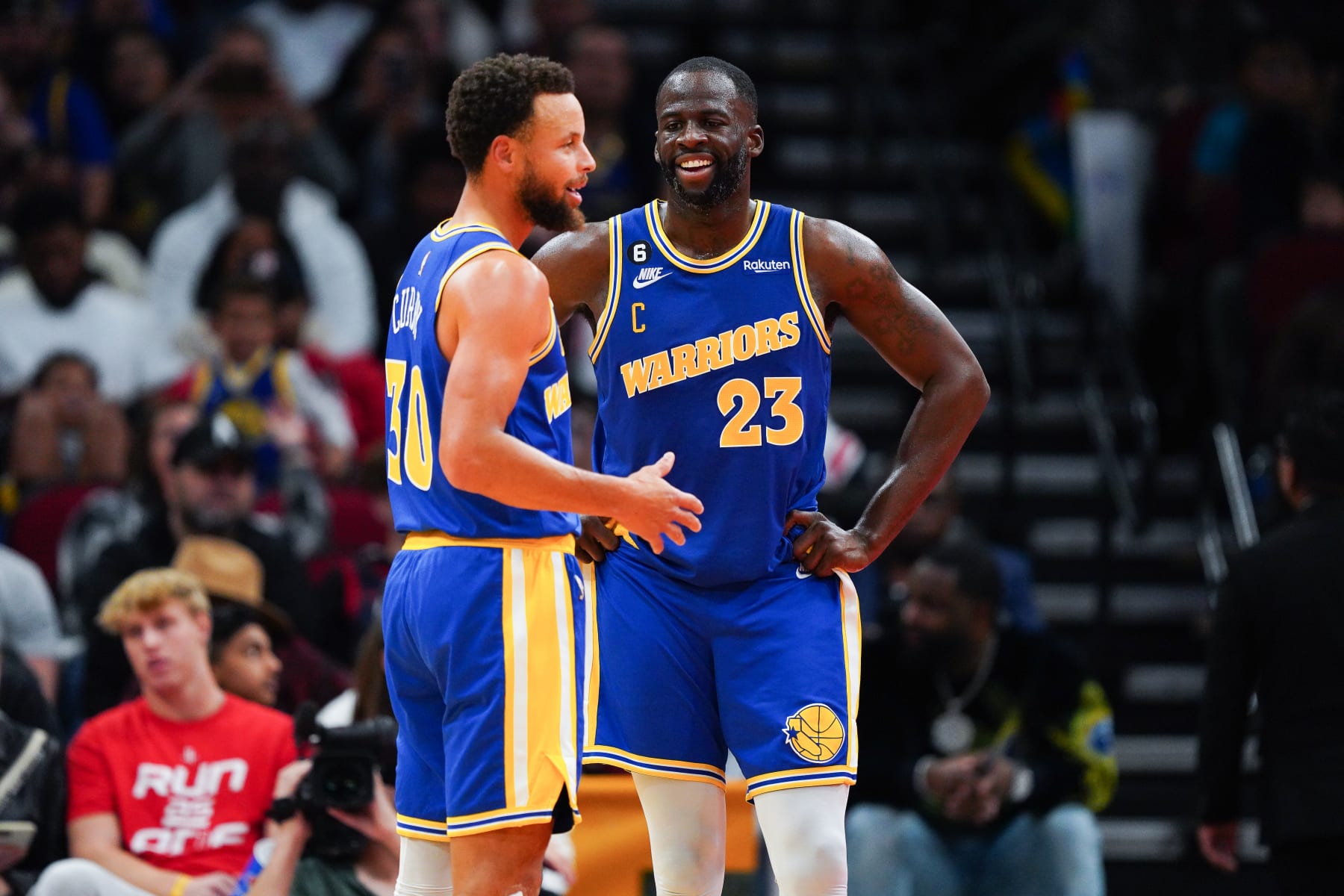 HOUSTON, TEXAS - NOVEMBER 20: Stephen Curry #30 of the Golden State Warriors and Draymond Green #23 of the Golden State Warriors talk during a timeout in the fourth quarter of the game against the Houston Rockets at Toyota Center on November 20, 2022 in Houston, Texas. NOTE TO USER: User expressly acknowledges and agrees that, by downloading and or using this photograph, User is consenting to the terms and conditions of the Getty Images License Agreement. (Photo by Alex Bierens de Haan/Getty Images)