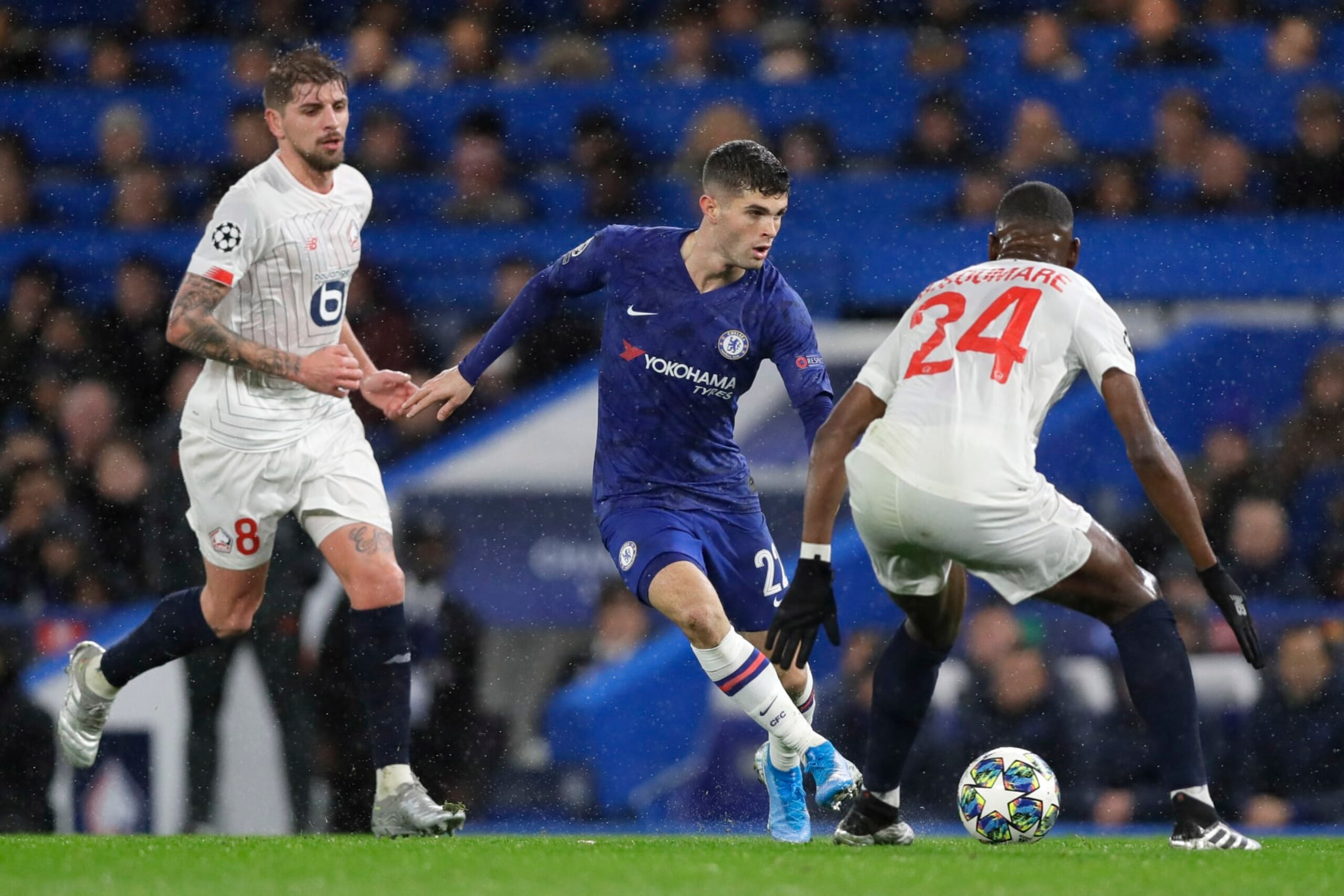 Chelsea's Christian Pulisic fights for the ball against Lille's Boubakary Soumare during the Champions League Group H soccer match between Chelsea and Lille at Stamford Bridge stadium in London Tuesday, Dec. 10, 2019. (AP Photo/Kirsty Wigglesworth)
