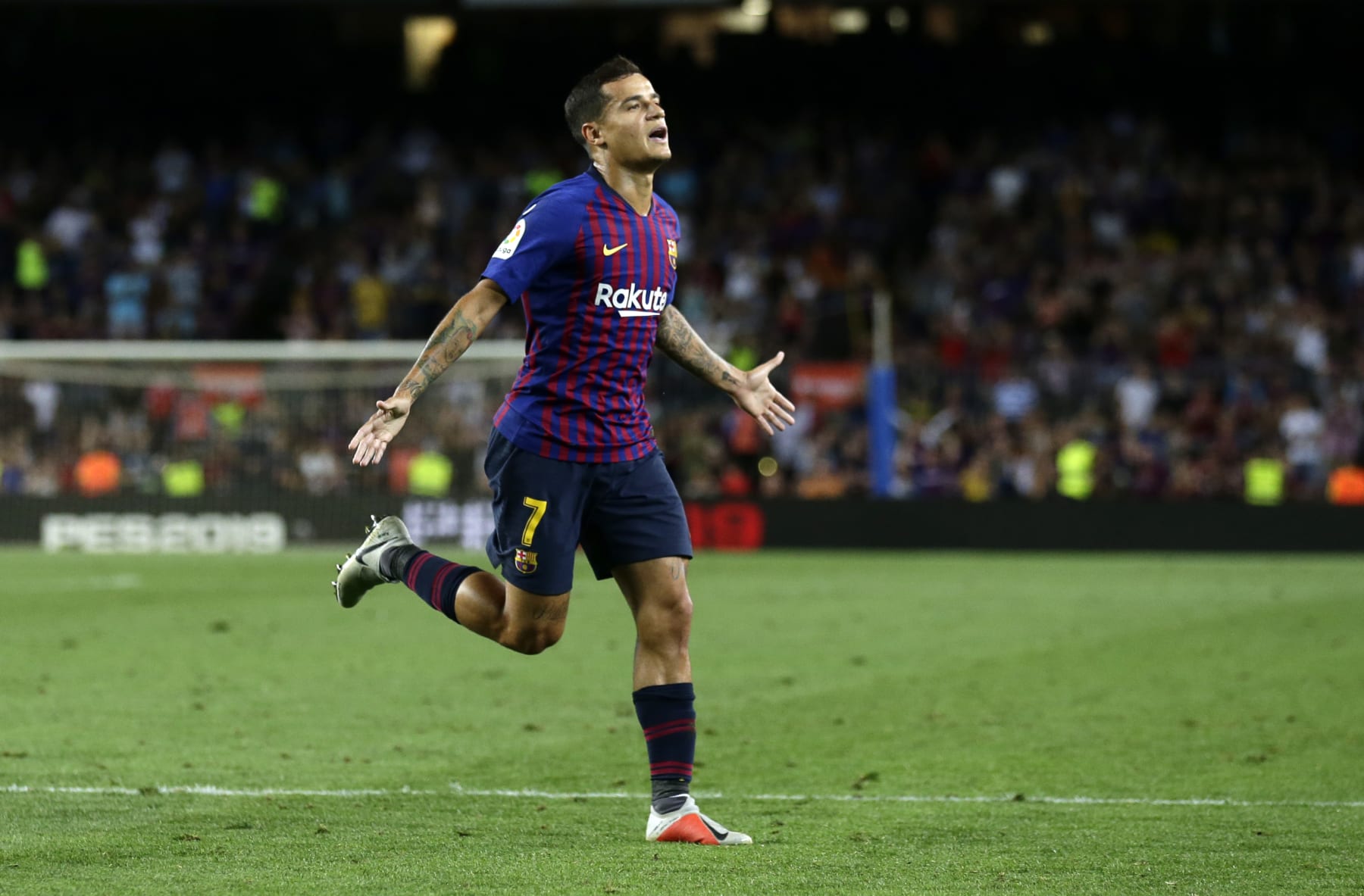 FC Barcelona's Coutinho celebrates after scoring during the team's Spanish La Liga soccer match against Alaves at Camp Nou stadium in Barcelona, Spain, Saturday, Aug. 18, 2018. (AP Photo/Manu Fernandez)