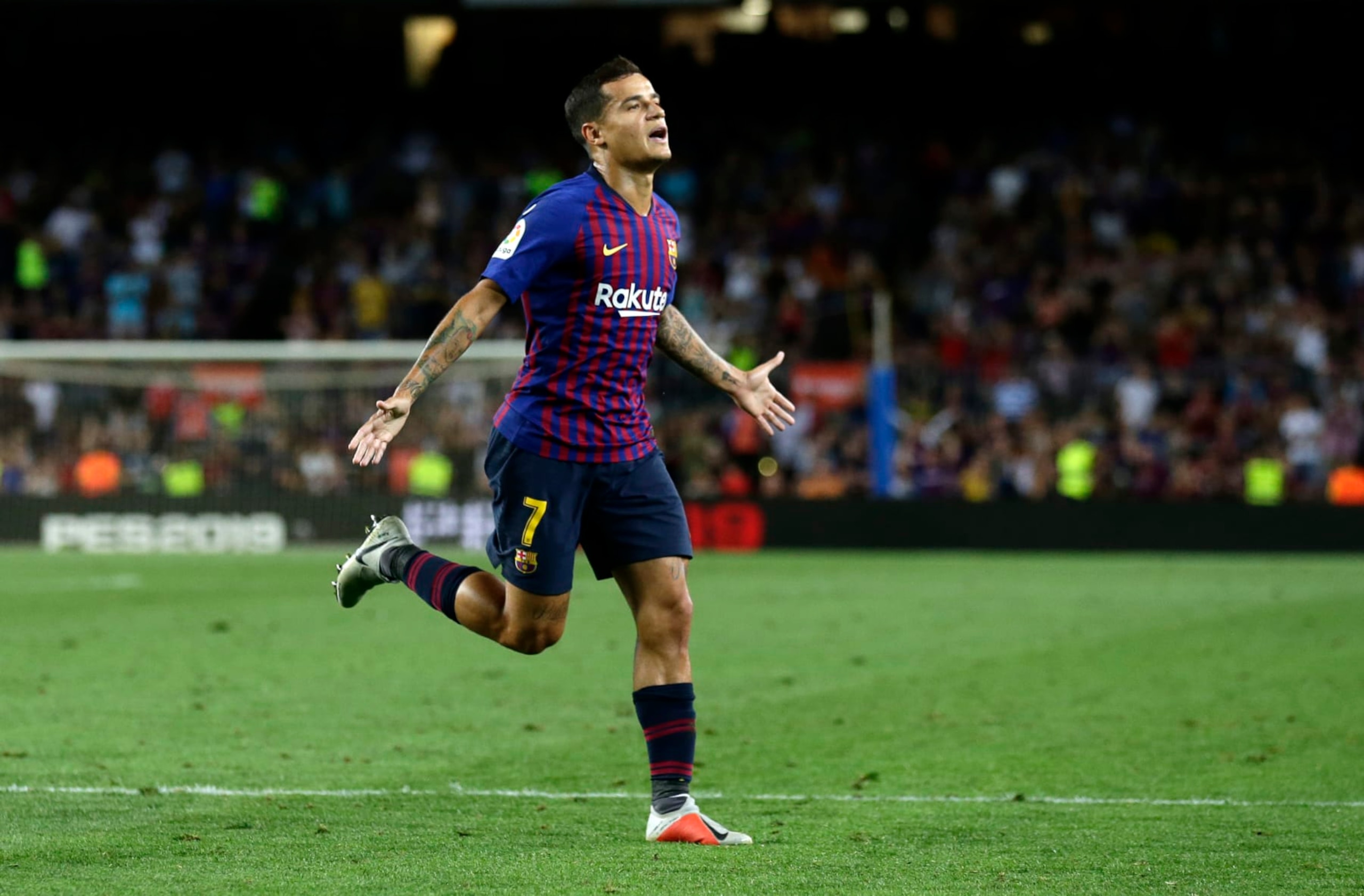 FC Barcelona's Coutinho celebrates after scoring during the team's Spanish La Liga soccer match against Alaves at Camp Nou stadium in Barcelona, Spain, Saturday, Aug. 18, 2018. (AP Photo/Manu Fernandez)