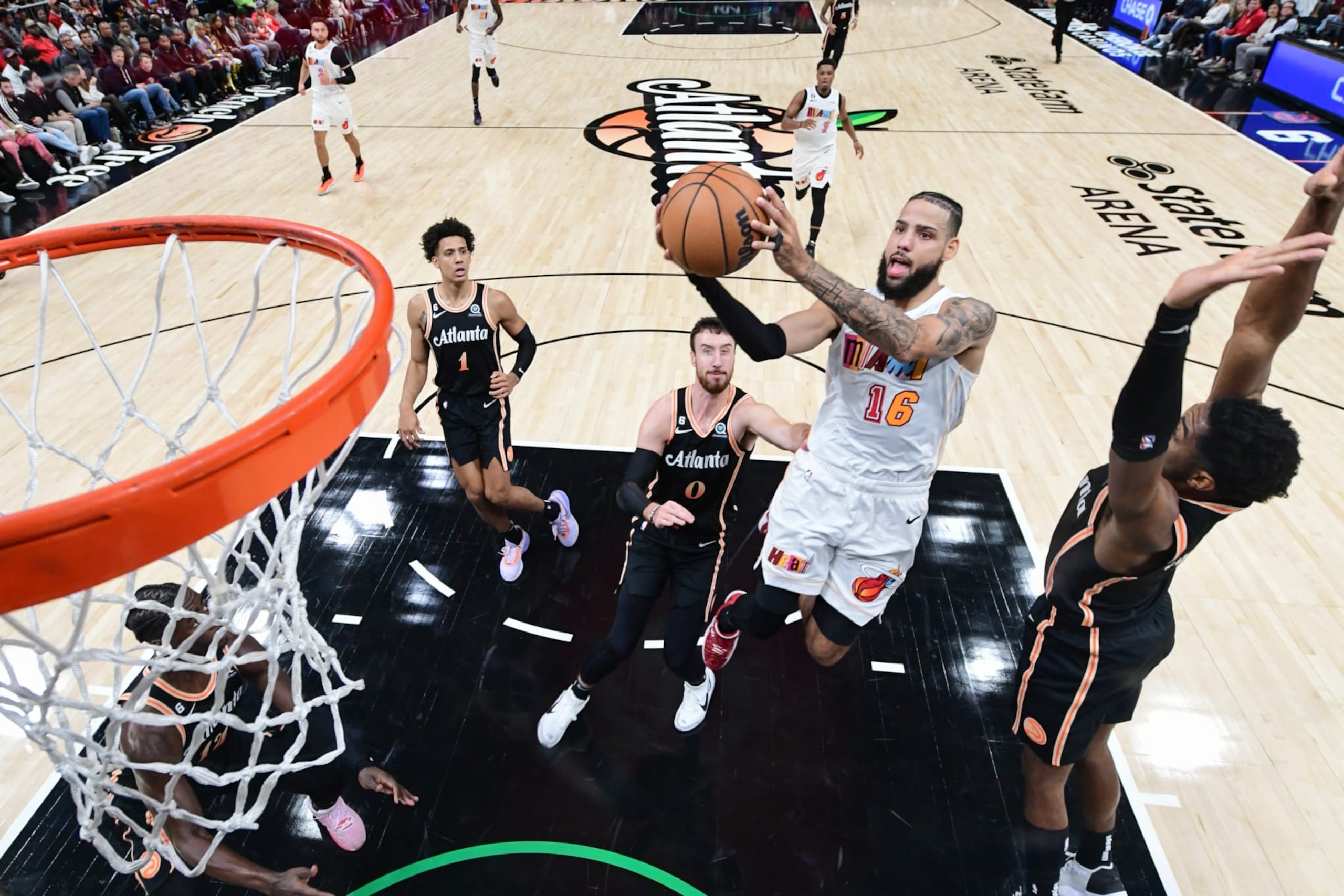 ATLANTA, GA - NOVEMBER 27: Caleb Martin #16 of the Miami Heat drives to the basket during the game against the Atlanta Hawks on November 27, 2022 at State Farm Arena in Atlanta, Georgia.  NOTE TO USER: User expressly acknowledges and agrees that, by downloading and/or using this Photograph, user is consenting to the terms and conditions of the Getty Images License Agreement. Mandatory Copyright Notice: Copyright 2022 NBAE (Photo by Adam Hagy/NBAE via Getty Images)