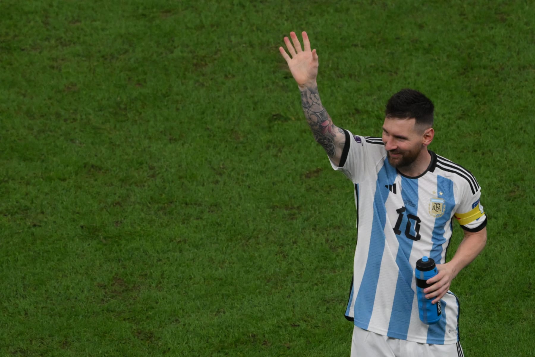 Argentina's forward #10 Lionel Messi waves at the end of the Qatar 2022 World Cup football semi-final match between Argentina and Croatia at Lusail Stadium in Lusail, north of Doha on December 13, 2022. (Photo by Paul ELLIS / AFP) (Photo by PAUL ELLIS/AFP via Getty Images)