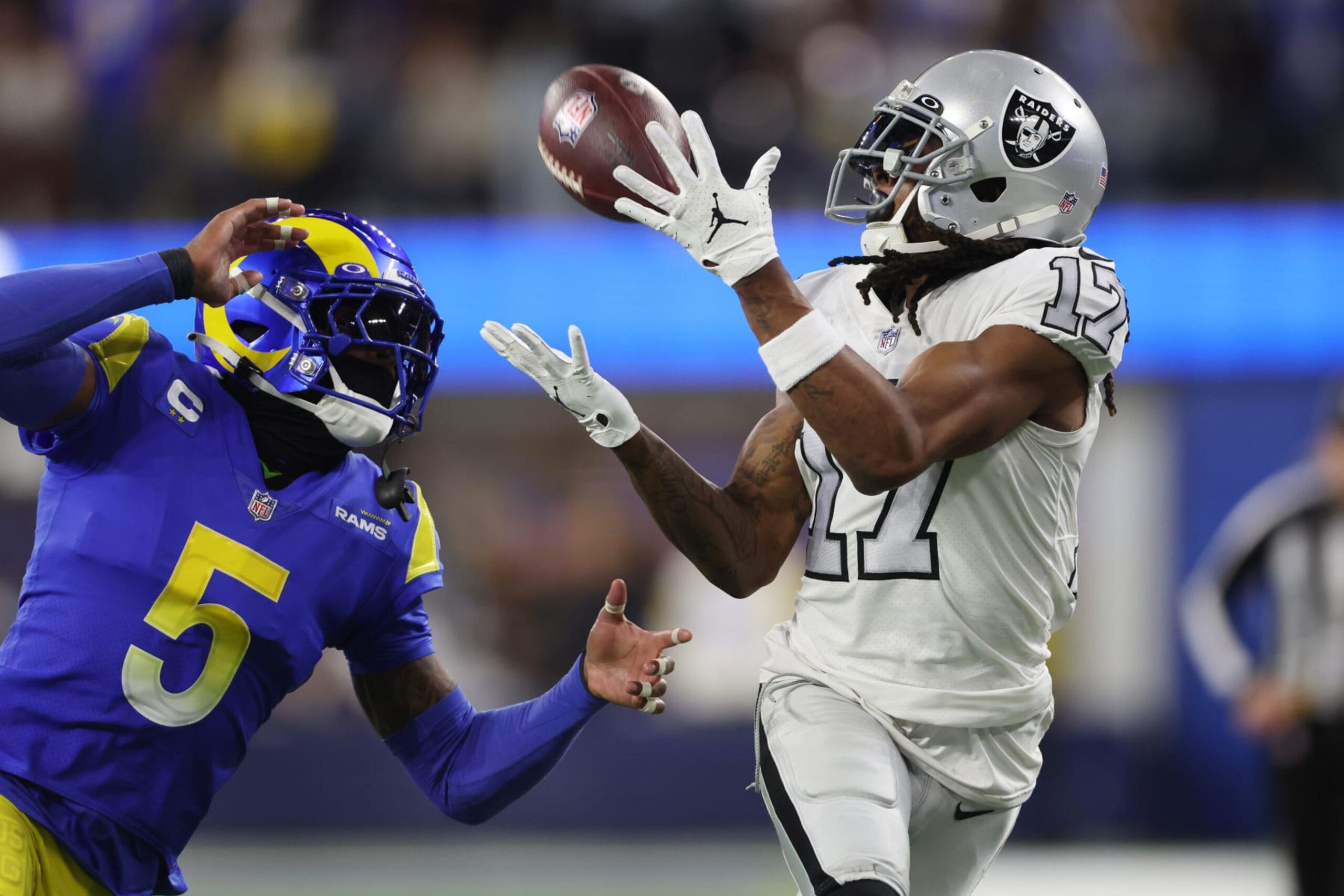 INGLEWOOD, CALIFORNIA - DECEMBER 08: Davante Adams #17 of the Las Vegas Raiders makes a reception past Jalen Ramsey #5 of the Los Angeles Rams during the second quarter at SoFi Stadium on December 08, 2022 in Inglewood, California. (Photo by Sean M. Haffey/Getty Images)