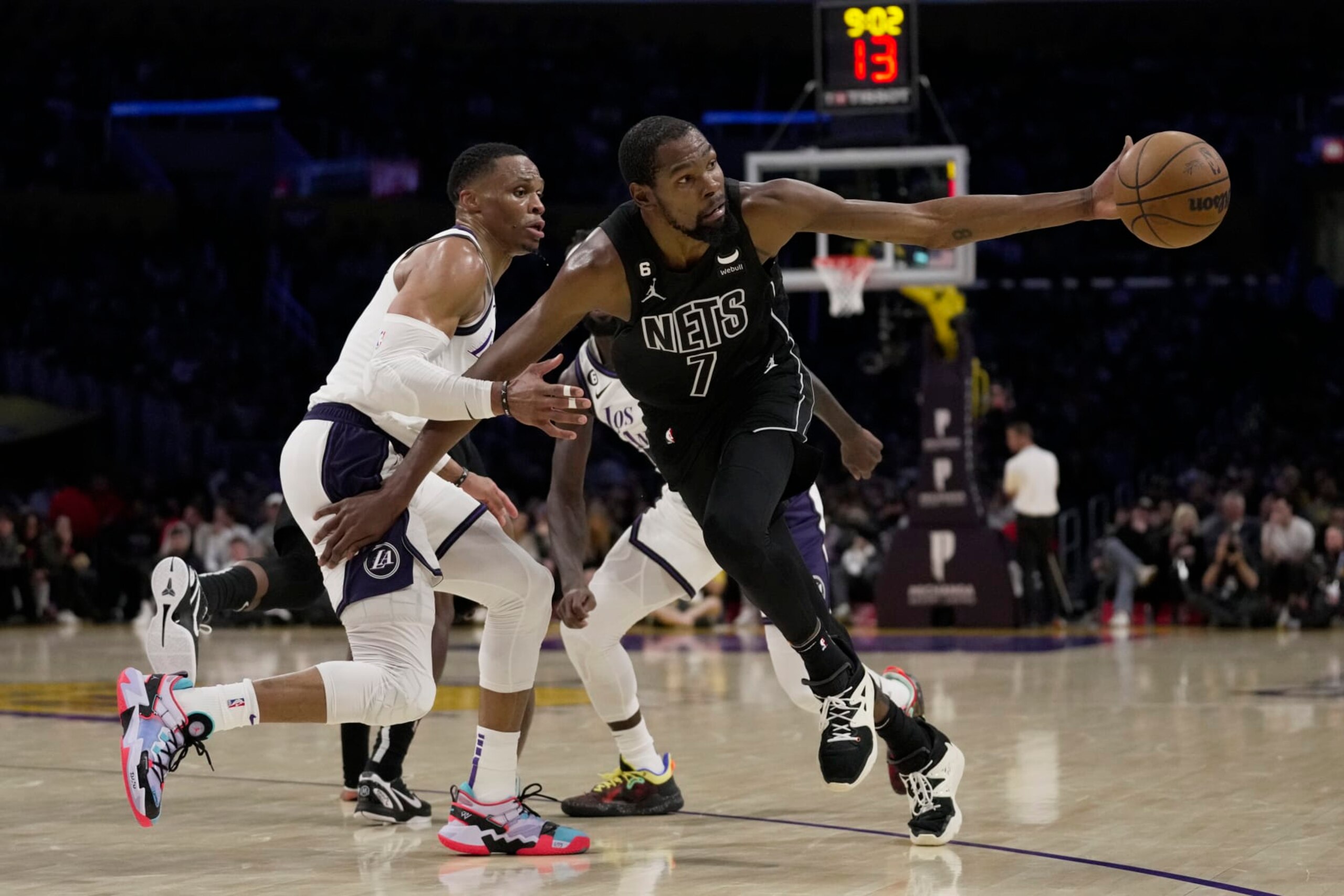 Brooklyn Nets forward Kevin Durant (7) loses the ball while defended by Los Angeles Lakers guard Russell Westbrook (0) during the first half of an NBA basketball game in Los Angeles, Sunday, Nov. 13, 2022. (AP Photo/Ashley Landis) Brooklyn Nets forward Kevin Durant (7) loses the ball while defended by Los Angeles Lakers guard Russell Westbrook (0) during the first half of an NBA basketball game in Los Angeles, Sunday, Nov. 13, 2022. (AP Photo/Ashley Landis)