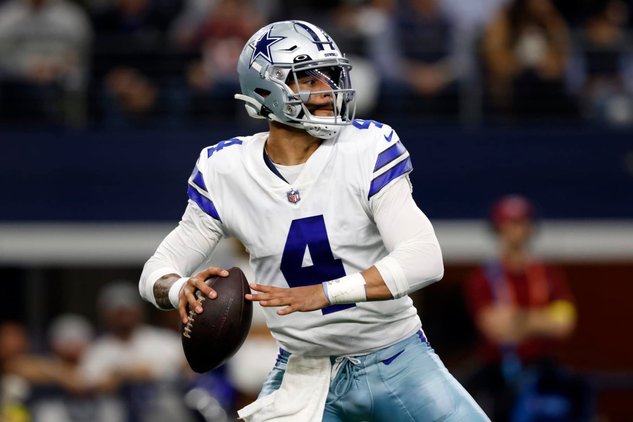 Dallas Cowboys quarterback Dak Prescott (4) looks to throw during the first half of an NFL football game against the Houston Texans, Sunday, Dec. 11, 2022, in Arlington, Texas. (AP Photo/Ron Jenkins) Dallas Cowboys quarterback Dak Prescott (4) looks to throw during the first half of an NFL football game against the Houston Texans, Sunday, Dec. 11, 2022, in Arlington, Texas. (AP Photo/Ron Jenkins)